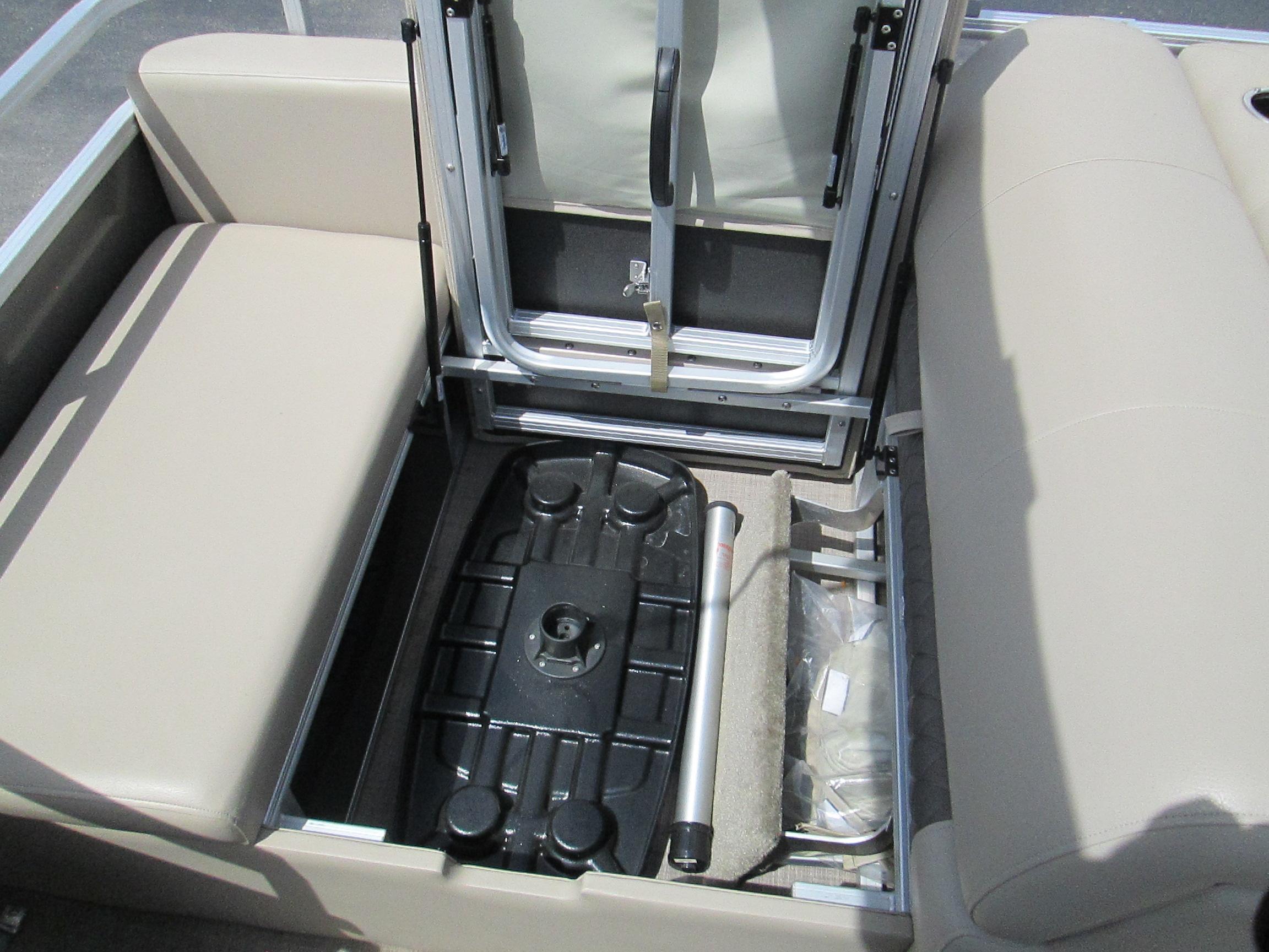 2023 Sun Tracker PARTY BARGE 22RF XP3 storage compartment with seating and equipment.