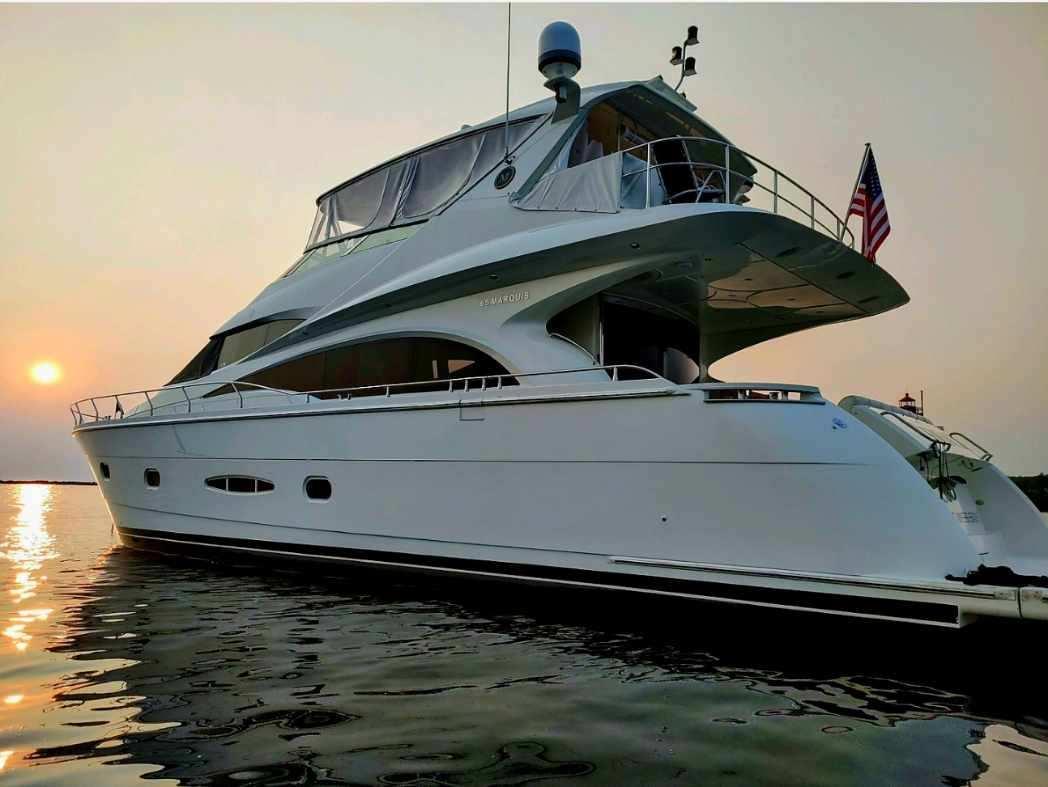 Marquis-65 2005-Tenacity FL-US-Luxury 2005 Marquis 65 yacht on calm water at sunset.-9656261