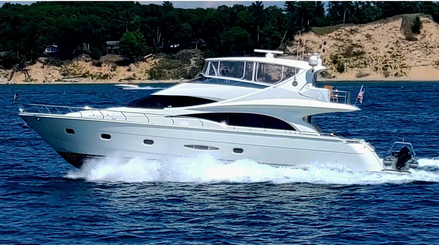 Marquis-65 2005-Tenacity FL-US-2005 Marquis 65 yacht cruising on blue water near sandy shoreline.-9656261 | Thumbnail