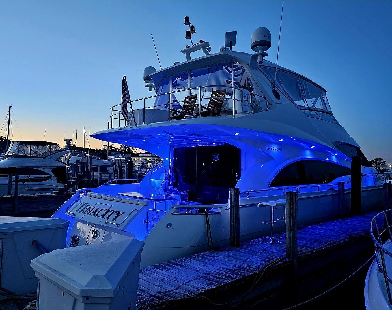 Marquis-65 2005-Tenacity FL-US-Luxurious 2005 Marquis 65 yacht docked at sunset with blue LED lights.-9656261 | Thumbnail