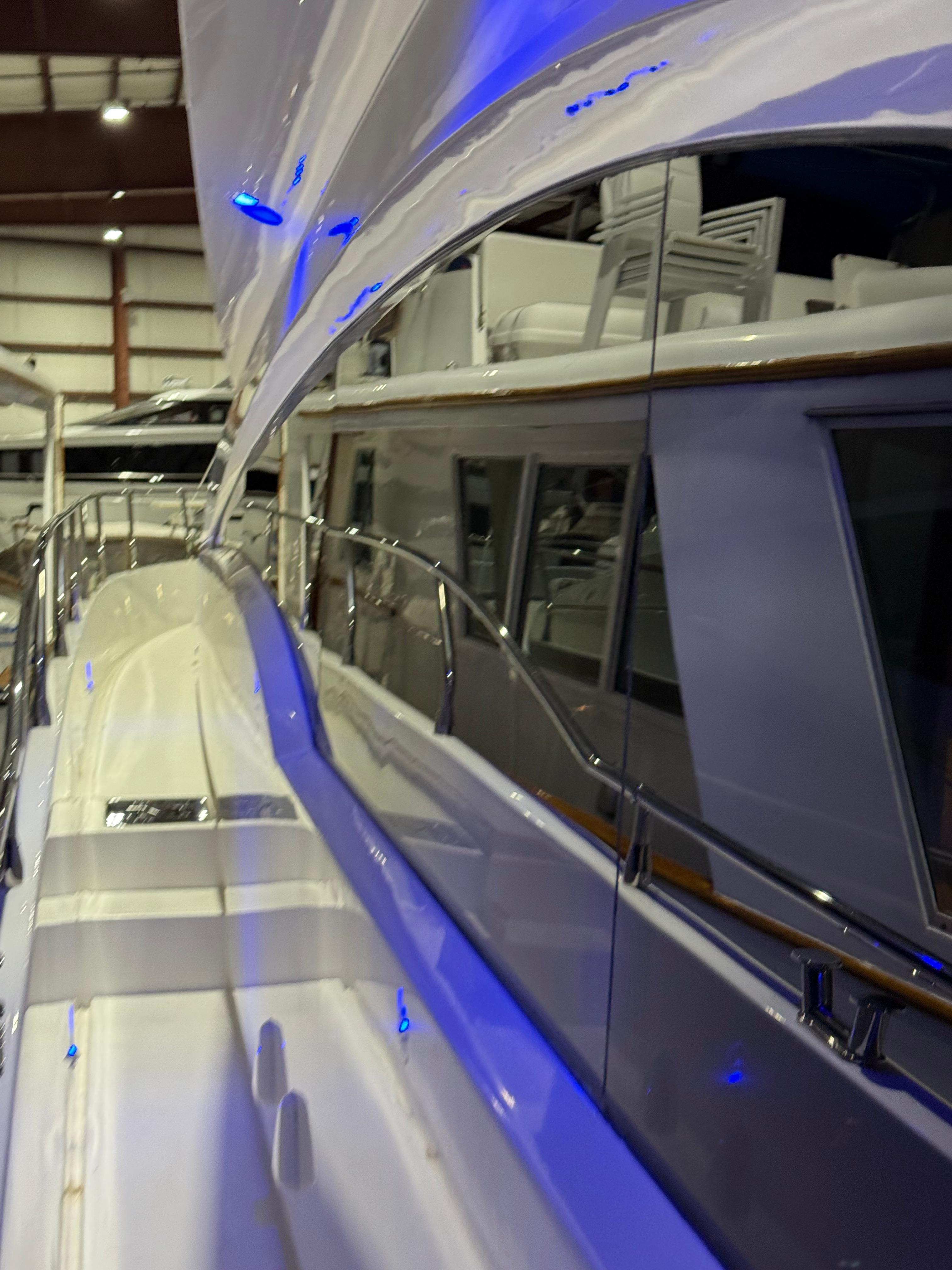 Marquis-65 2005-Tenacity FL-US-2005 Marquis 65 yacht with sleek design and blue accent lighting in a showroom.-9656261 | Thumbnail