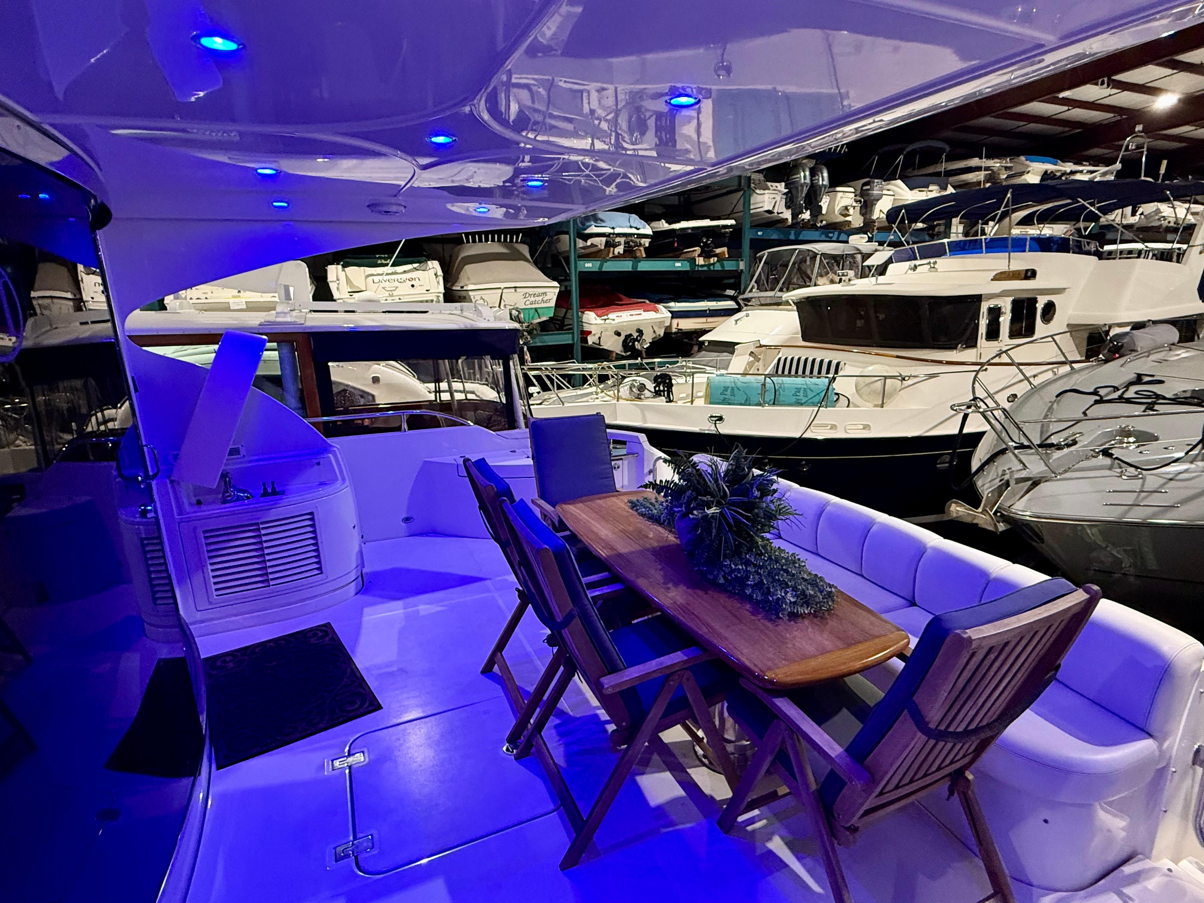 Marquis-65 2005-Tenacity FL-US-Luxurious 2005 Marquis 65 yacht interior with elegant seating and ambient blue lighting.-9656261 | Thumbnail