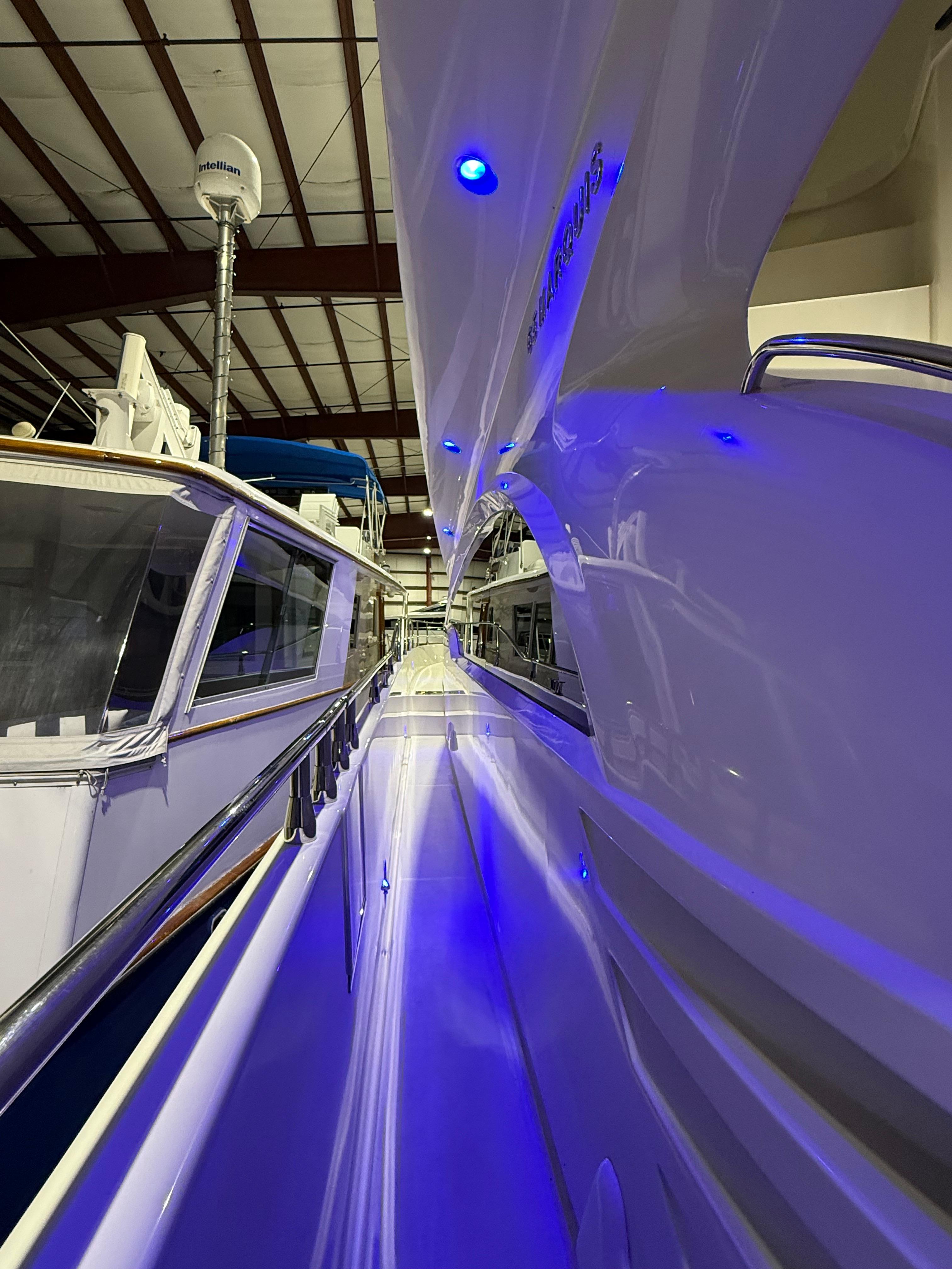 Marquis-65 2005-Tenacity FL-US-2005 Marquis 65 yacht in a marina, illuminated by blue lights.-9656261 | Thumbnail