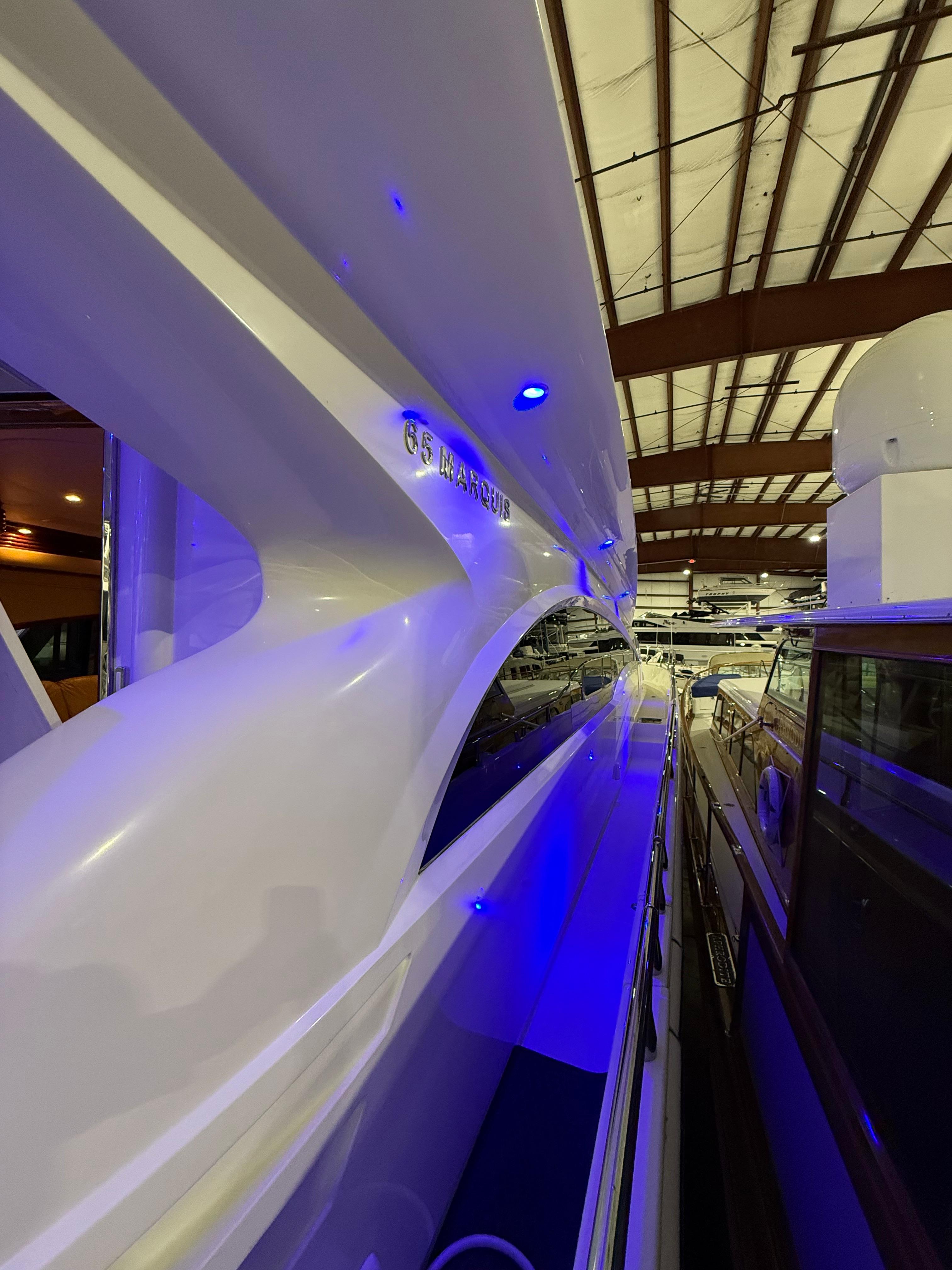 Marquis-65 2005-Tenacity FL-US-2005 Marquis 65 yacht in a dimly lit indoor marina with blue accent lighting.-9656261 | Thumbnail