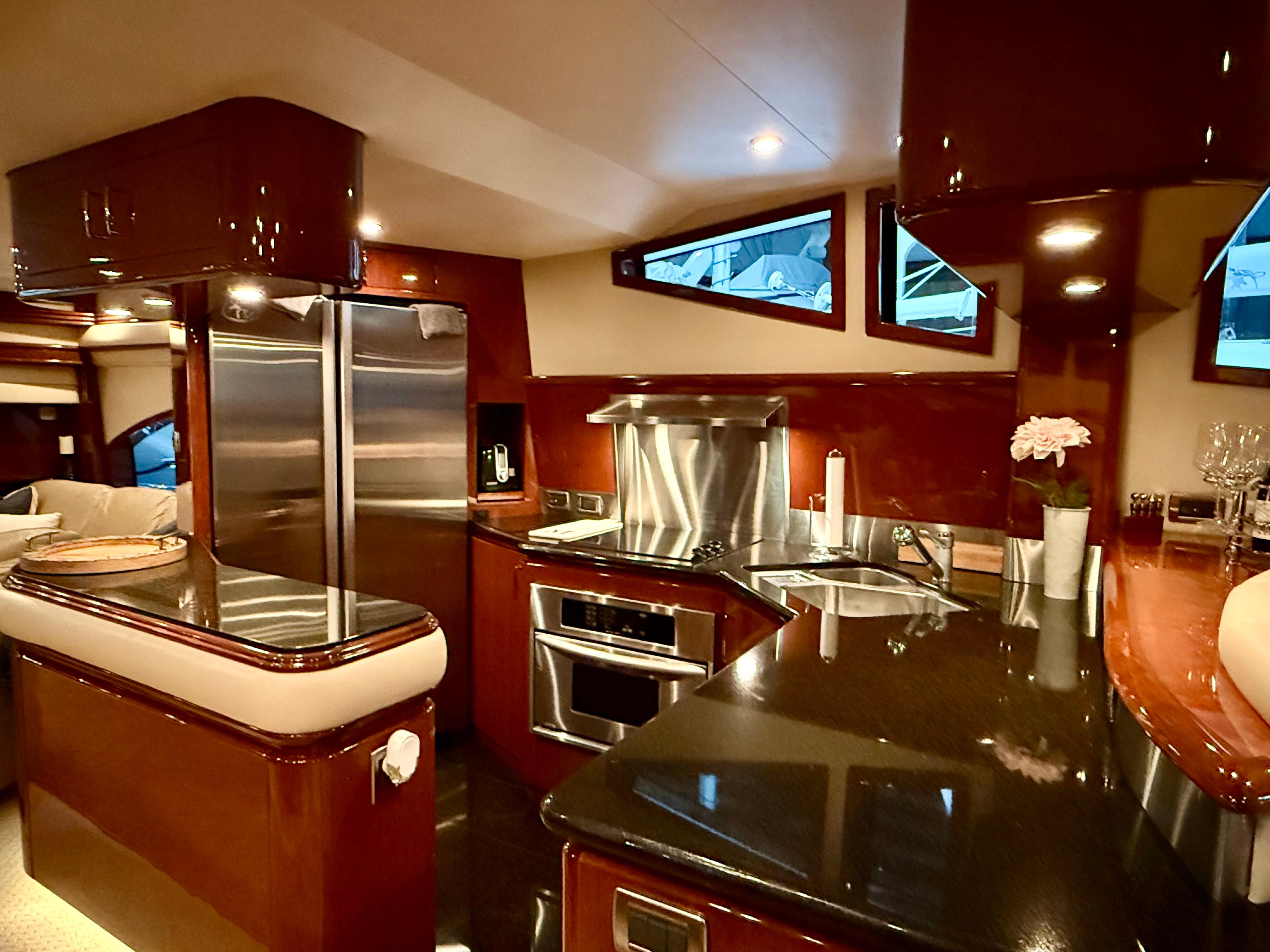 Marquis-65 2005-Tenacity FL-US-Luxurious kitchen interior of a 2005 Marquis 65 yacht with modern appliances.-9656261 | Thumbnail