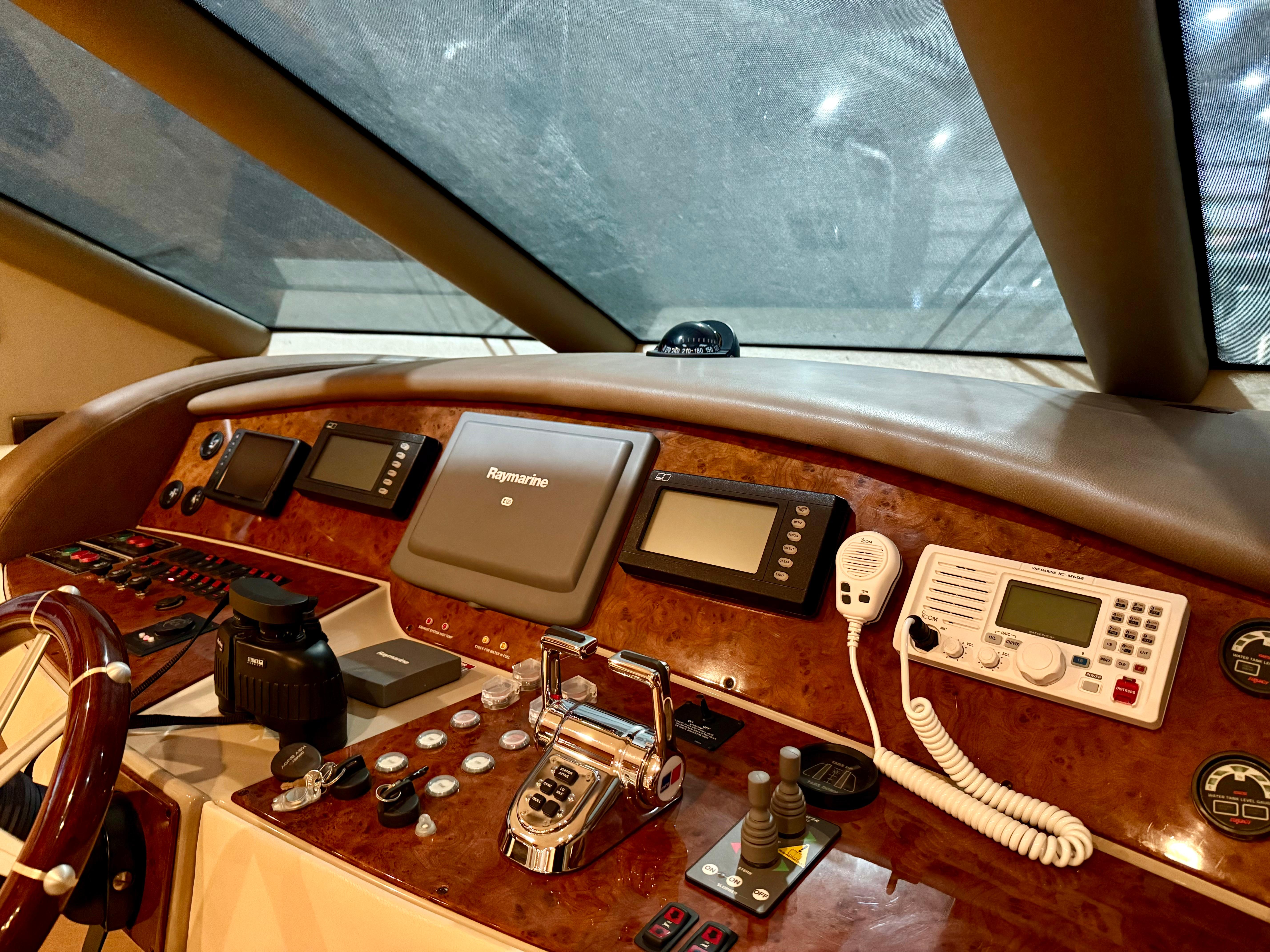 Marquis-65 2005-Tenacity FL-US-Control panel of a 2005 Marquis 65 yacht with navigation and communication equipment.-9656261 | Thumbnail