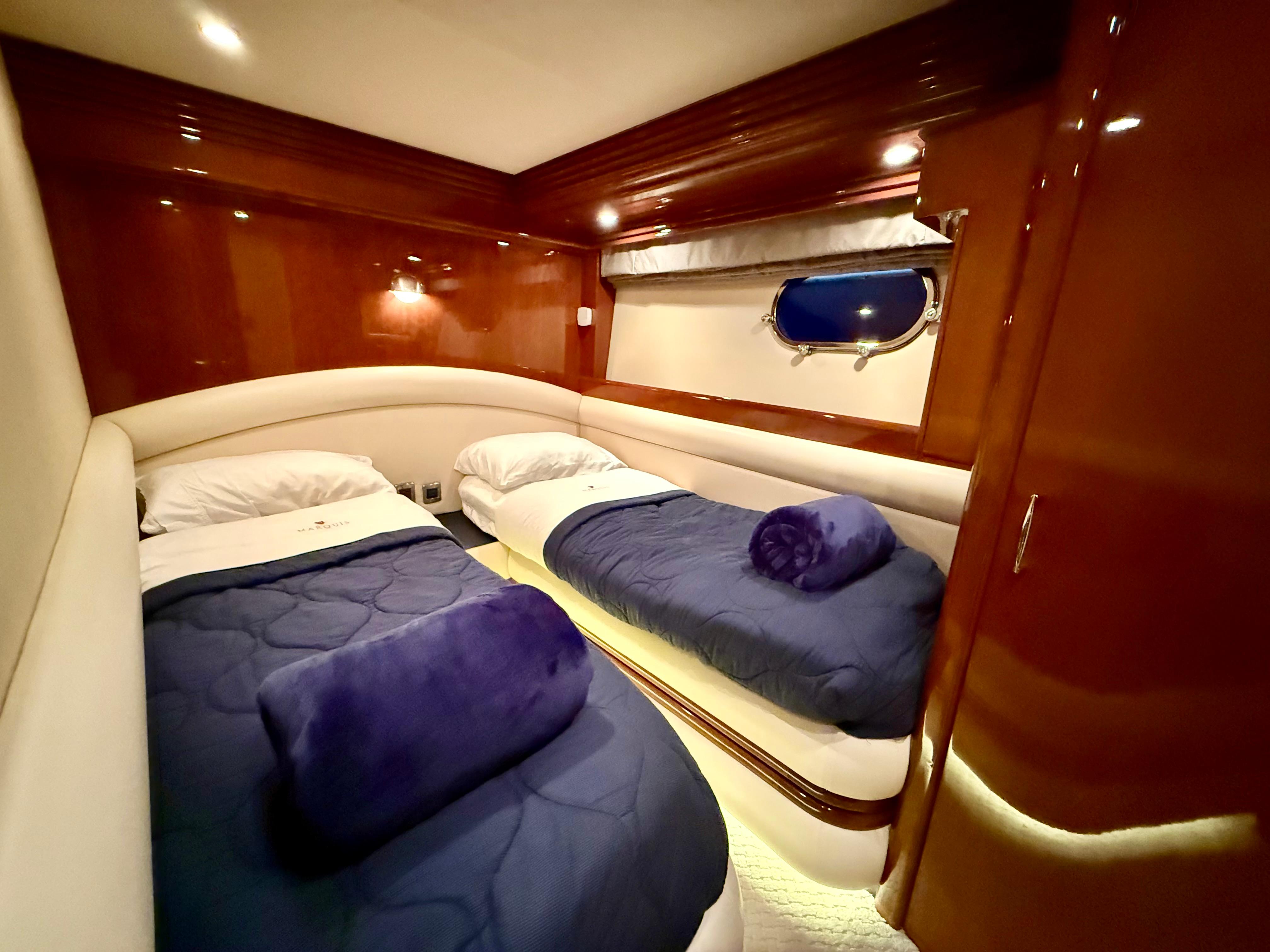Marquis-65 2005-Tenacity FL-US-Luxurious twin cabin in 2005 Marquis 65 yacht with plush bedding and elegant wood finishes.-9656261 | Thumbnail