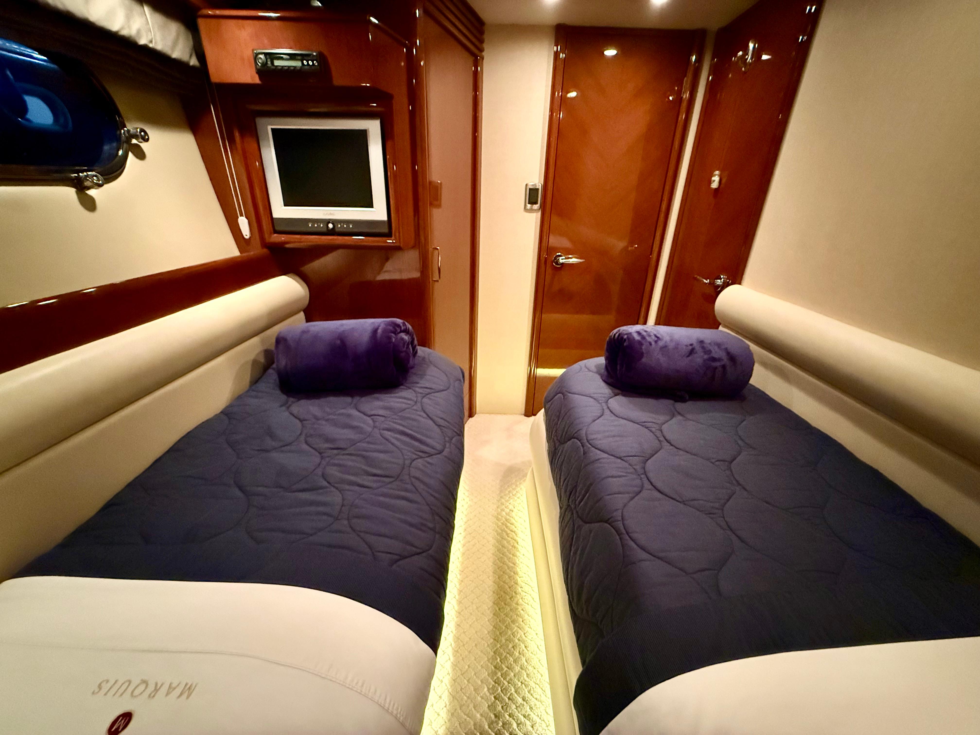 Marquis-65 2005-Tenacity FL-US-Luxurious twin cabin in 2005 Marquis 65 yacht with plush bedding and TV.-9656261 | Thumbnail