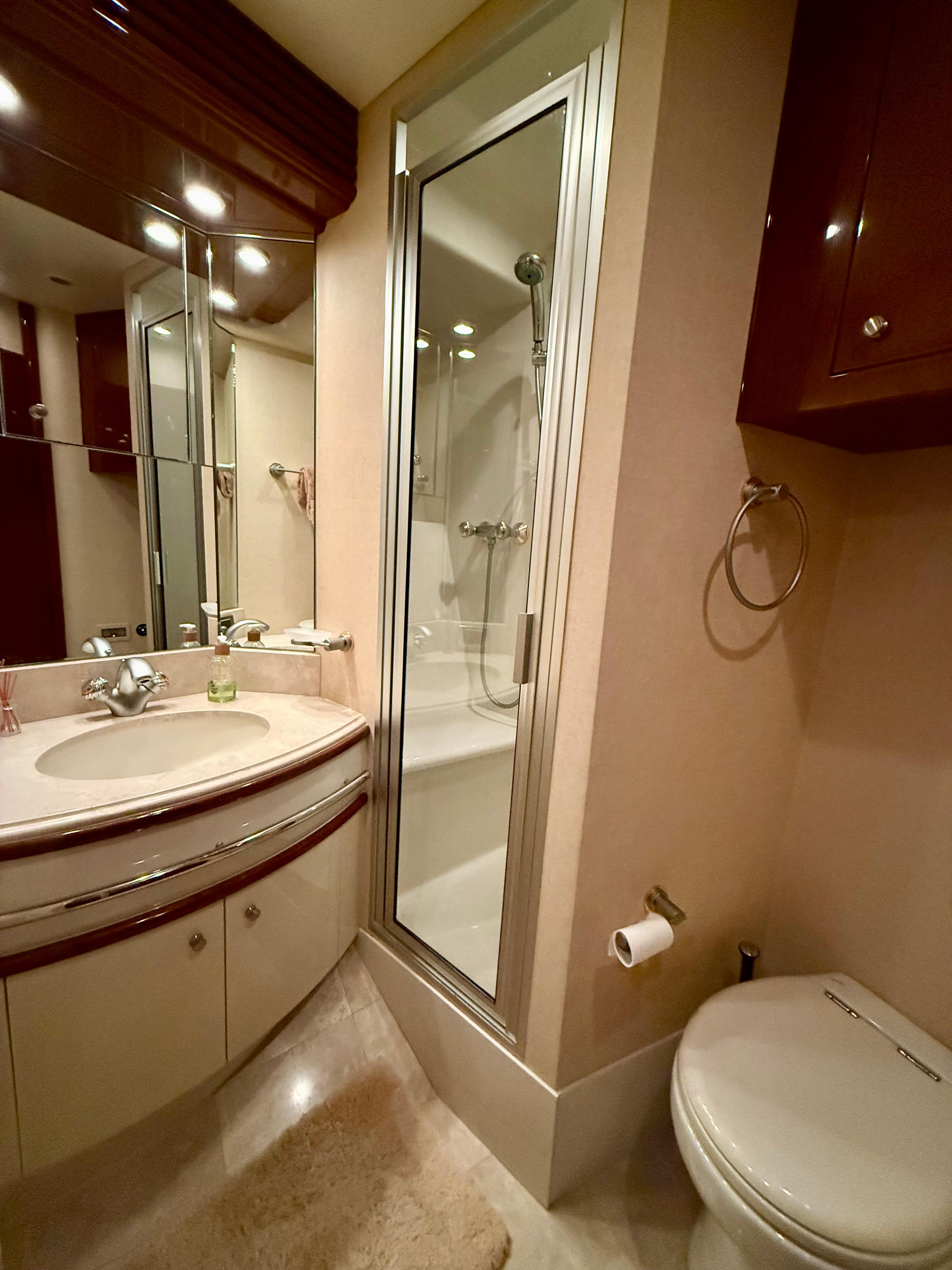 Marquis-65 2005-Tenacity FL-US-Luxurious bathroom in 2005 Marquis 65 yacht with shower, sink, and toilet.-9656261 | Thumbnail