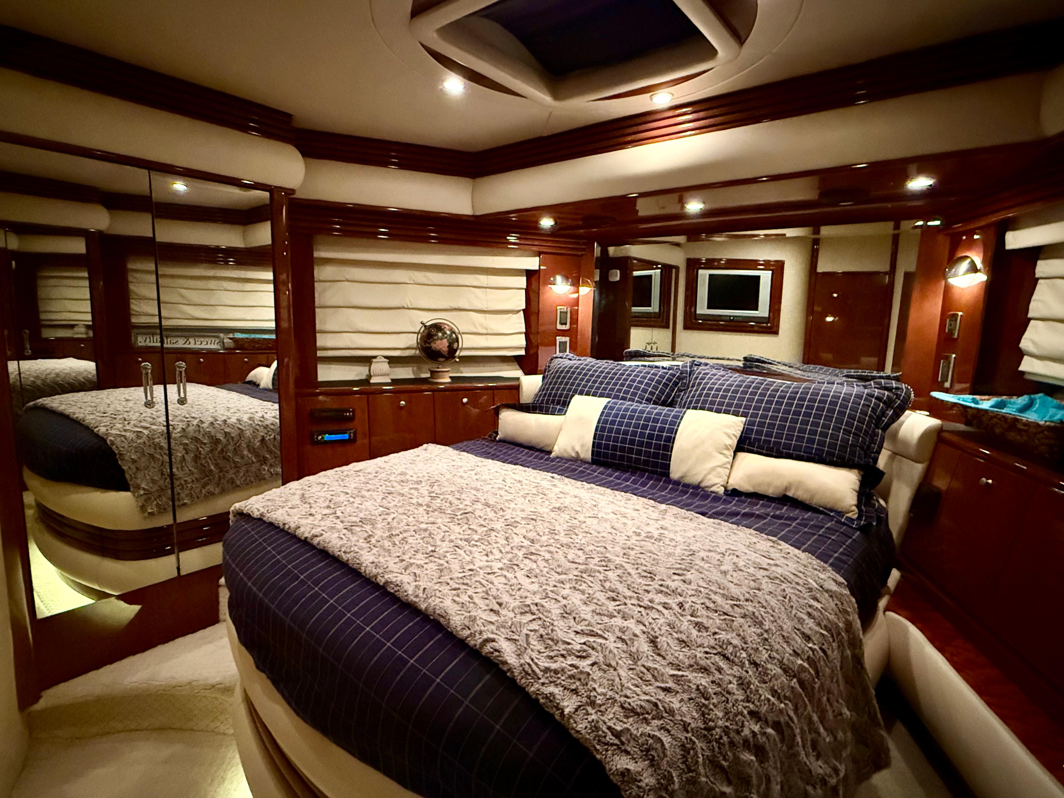Marquis-65 2005-Tenacity FL-US-Luxurious bedroom interior of a 2005 Marquis 65 yacht with elegant bedding and ambient lighting.-9656261 | Thumbnail