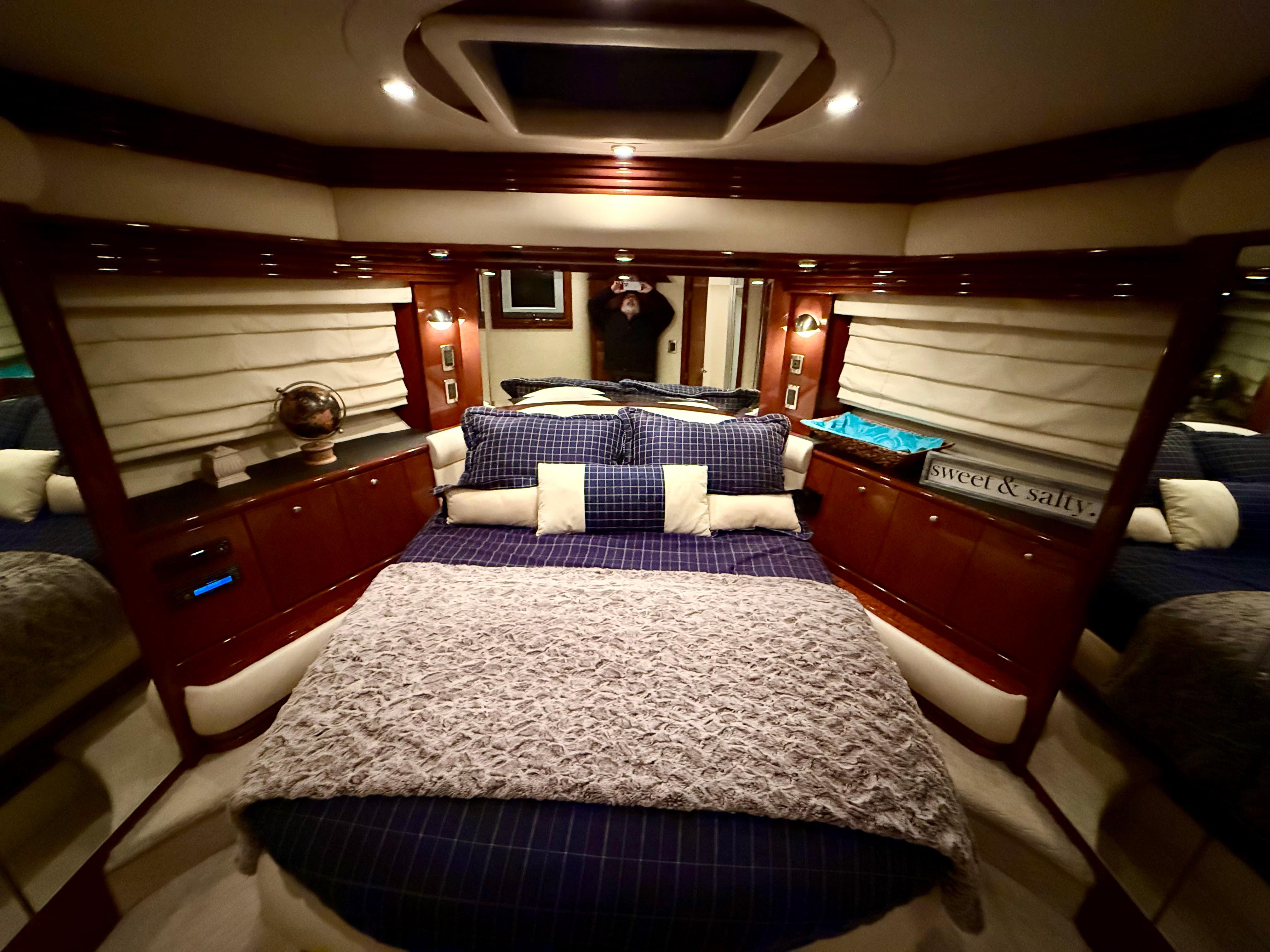 Marquis-65 2005-Tenacity FL-US-Luxurious bedroom interior of a 2005 Marquis 65 yacht, featuring elegant bedding and wood accents.-9656261 | Thumbnail
