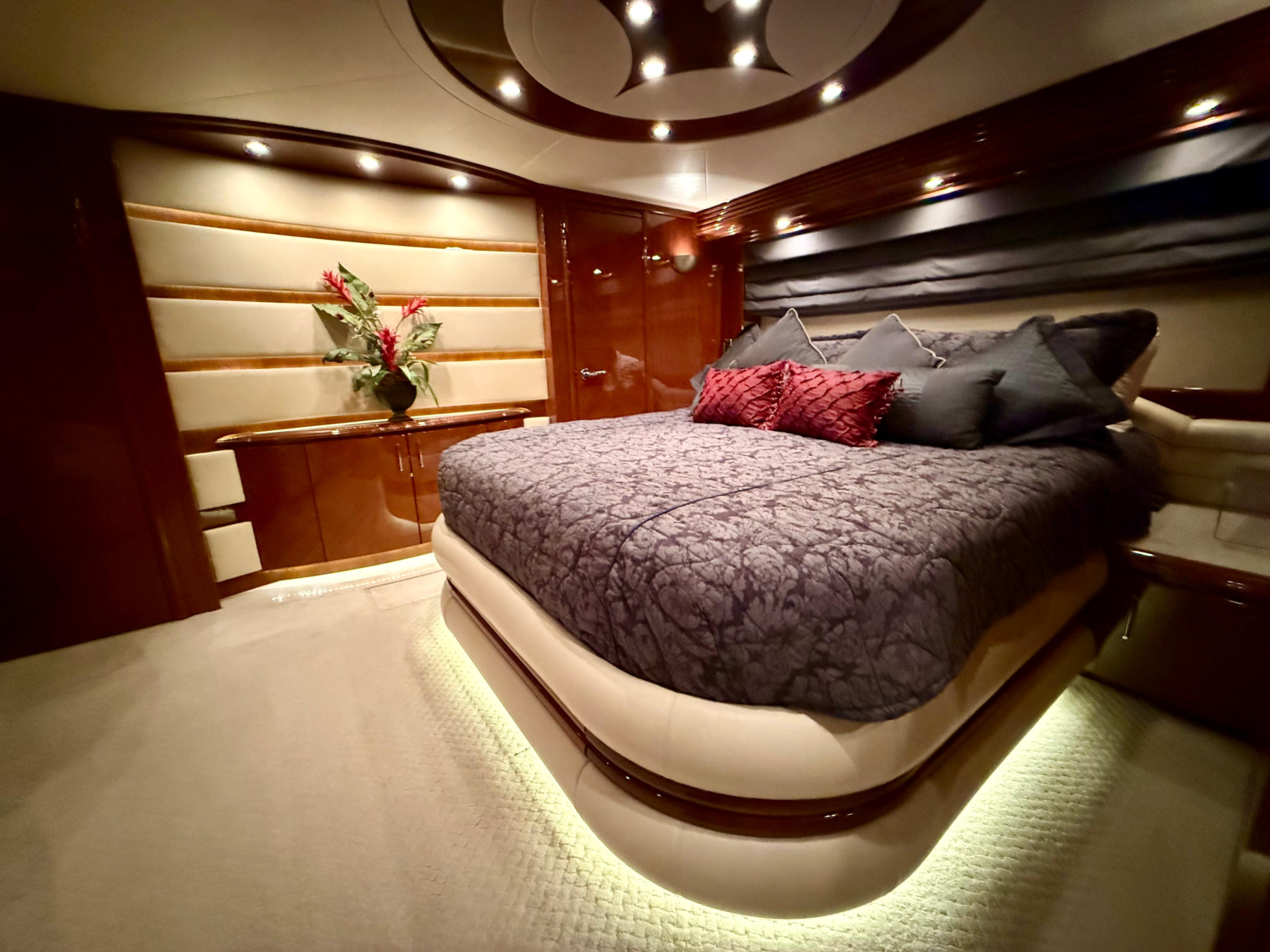 Marquis-65 2005-Tenacity FL-US-Luxurious bedroom interior of a 2005 Marquis 65 yacht, featuring elegant lighting and plush bedding.-9656261 | Thumbnail