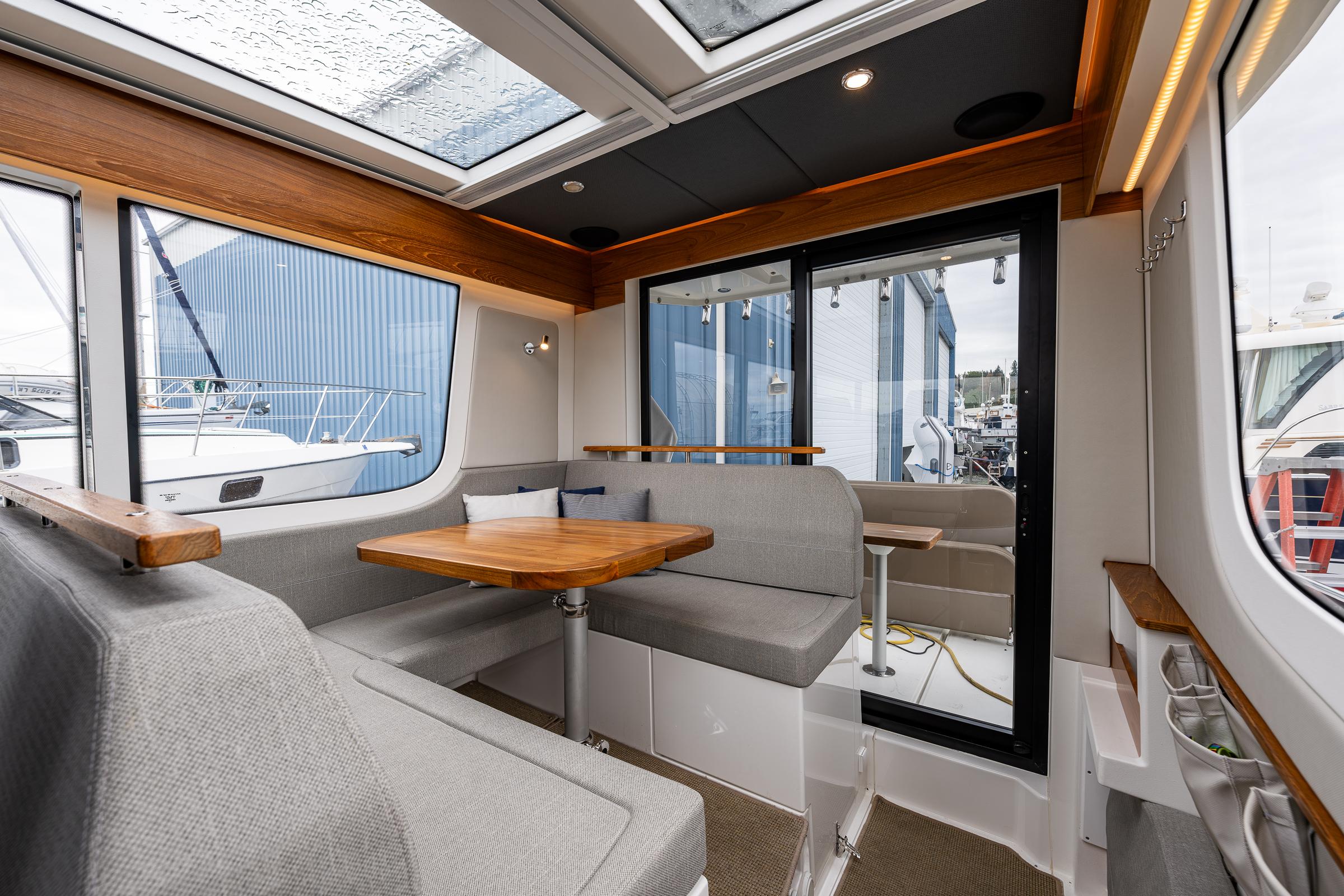 Nimbus-C11 2021-RYLEA ROSE WA-US-Interior of 2021 Nimbus C11 boat with modern seating and wooden accents.-9586288 | Thumbnail