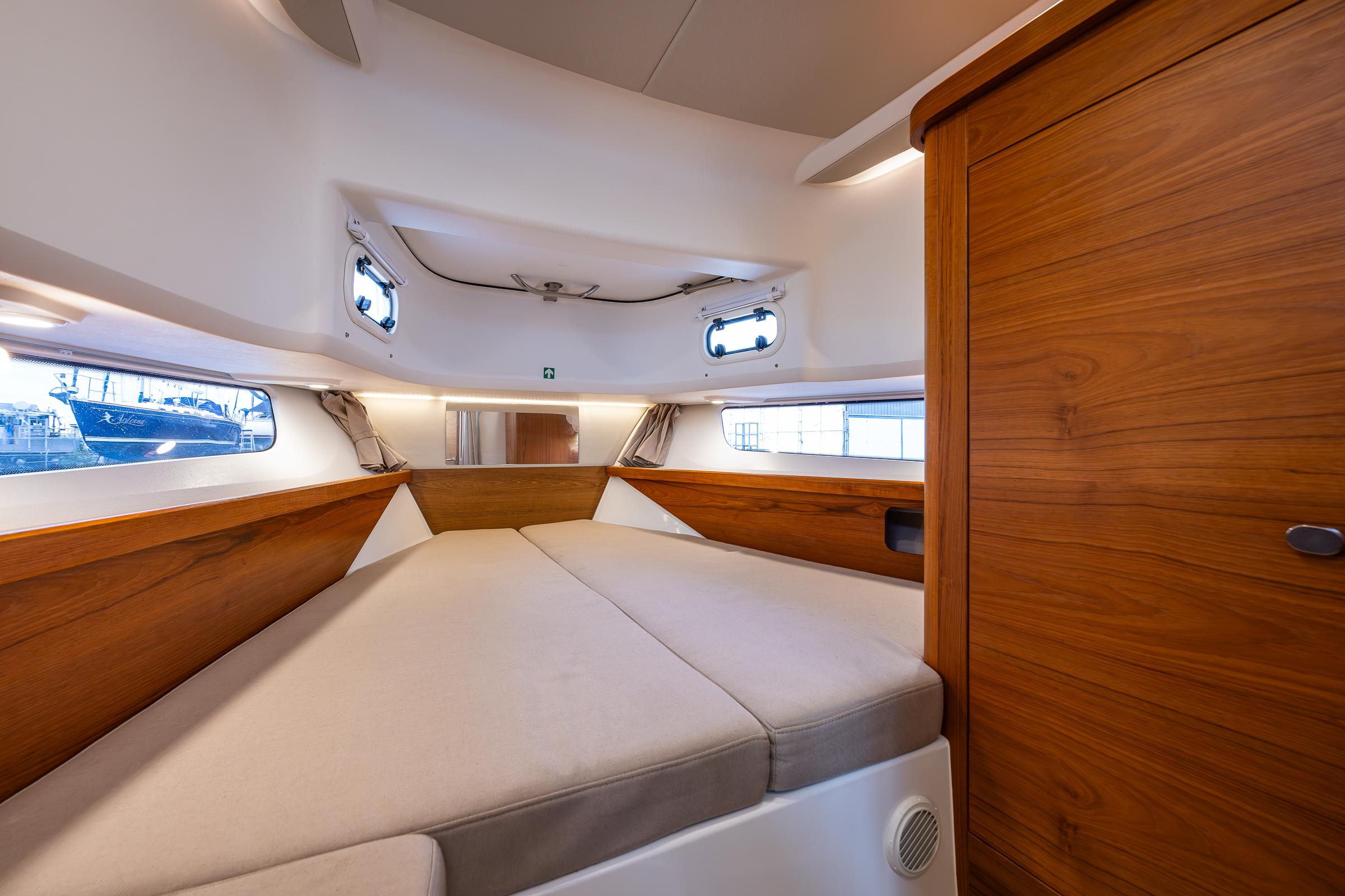 Nimbus-C11 2021-RYLEA ROSE WA-US-Luxurious interior cabin of 2021 Nimbus C11 boat with wooden accents and cozy bedding.-9586288 | Thumbnail