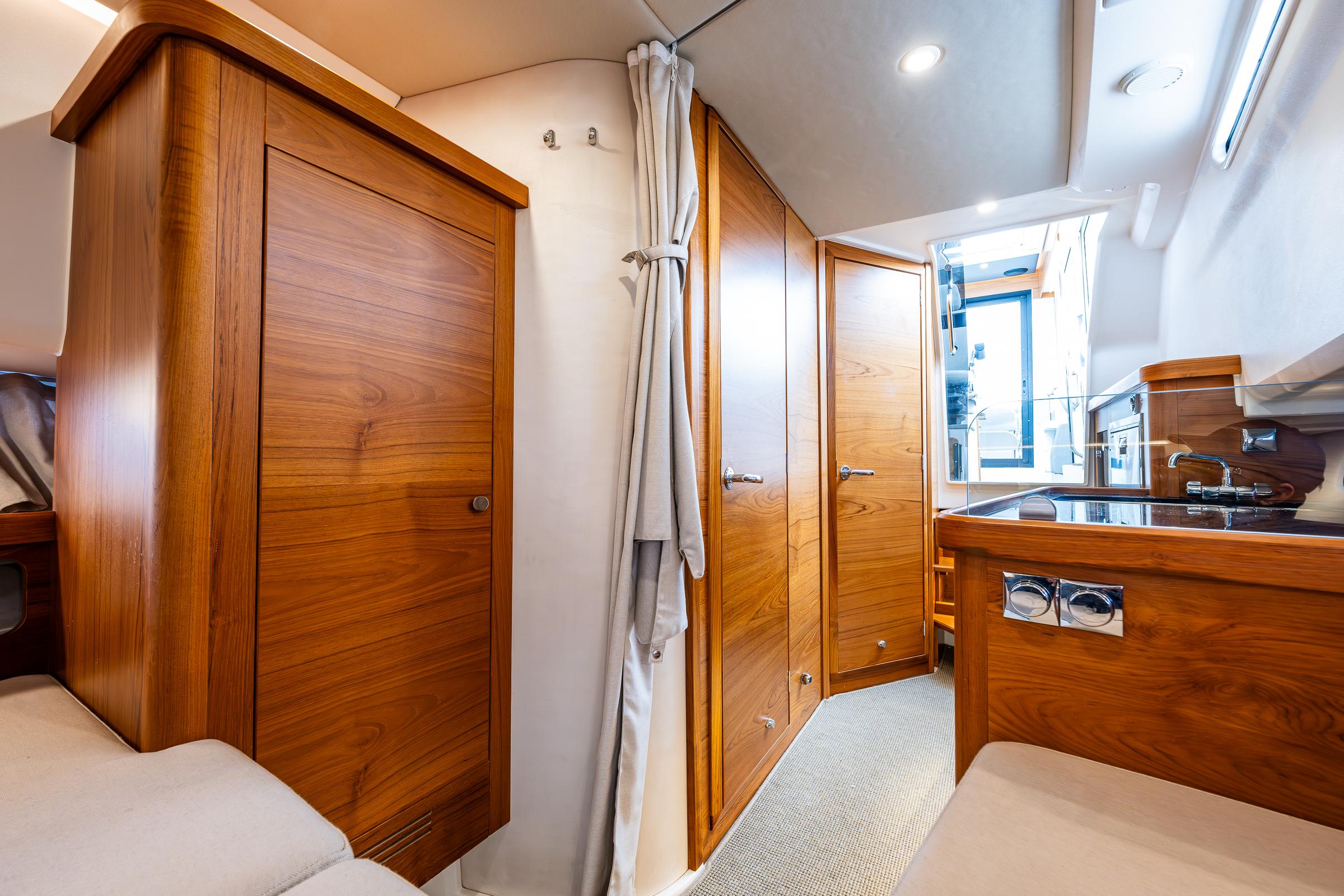 Nimbus-C11 2021-RYLEA ROSE WA-US-Luxurious interior of 2021 Nimbus C11 boat with wooden cabinetry and modern amenities.-9586288 | Thumbnail