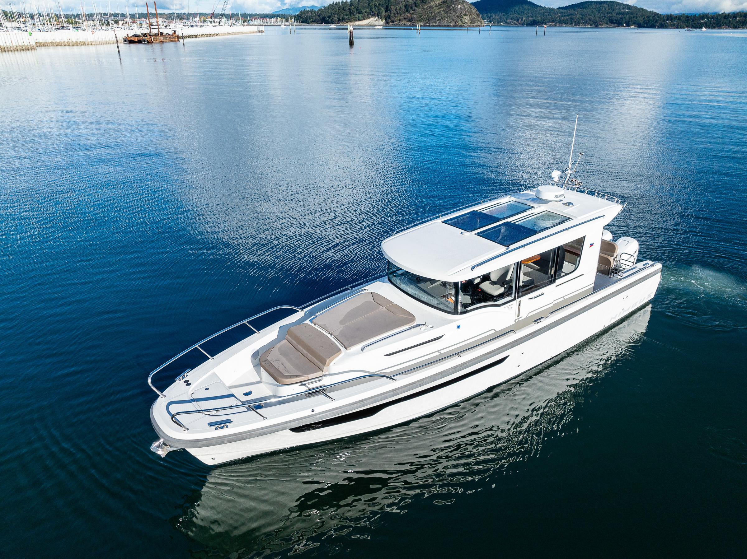 Nimbus-C11 2021-RYLEA ROSE WA-US-2021 Nimbus C11 boat cruising on calm waters with scenic background.-9586288 | Thumbnail
