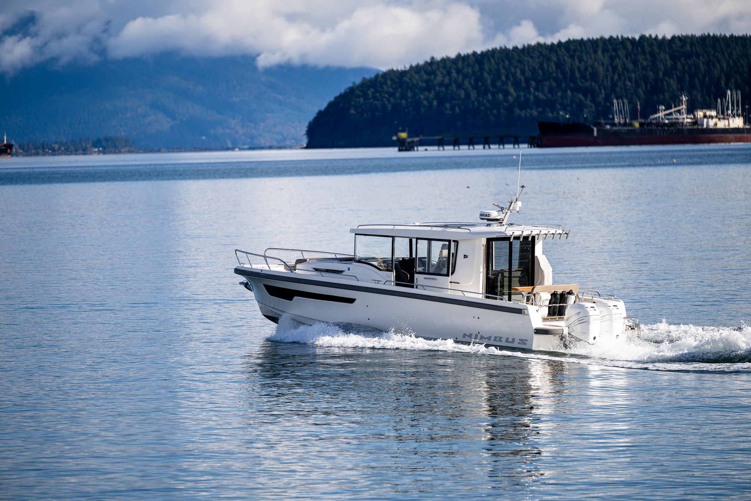 Nimbus-C11 2021-RYLEA ROSE WA-US-Nimbus C11 2021 boat cruising on a serene lake with forested hills in the background.-9586288 | Thumbnail