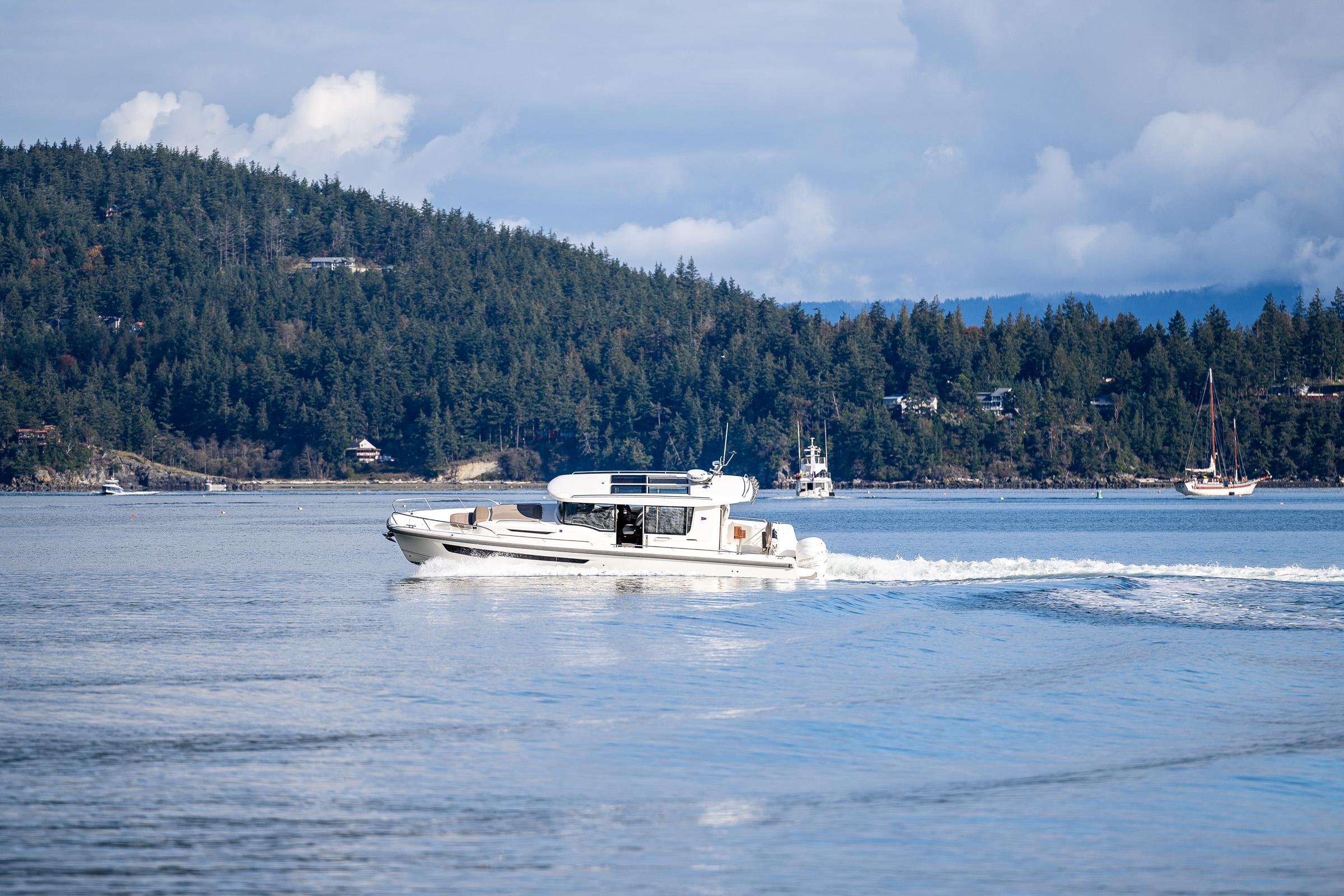 Nimbus-C11 2021-RYLEA ROSE WA-US-Nimbus C11 boat cruising on a serene lake with forested hills in the background.-9586288 | Thumbnail