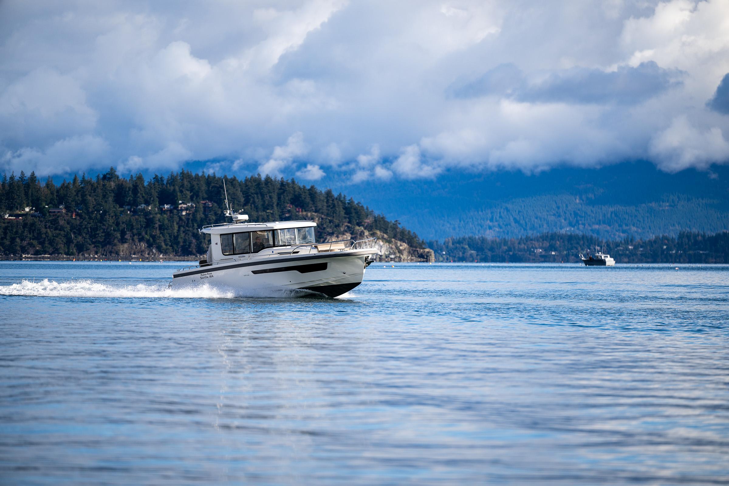 Nimbus-C11 2021-RYLEA ROSE WA-US-Nimbus C11 boat cruising on a serene lake with forested hills in the background.-9586288 | Thumbnail