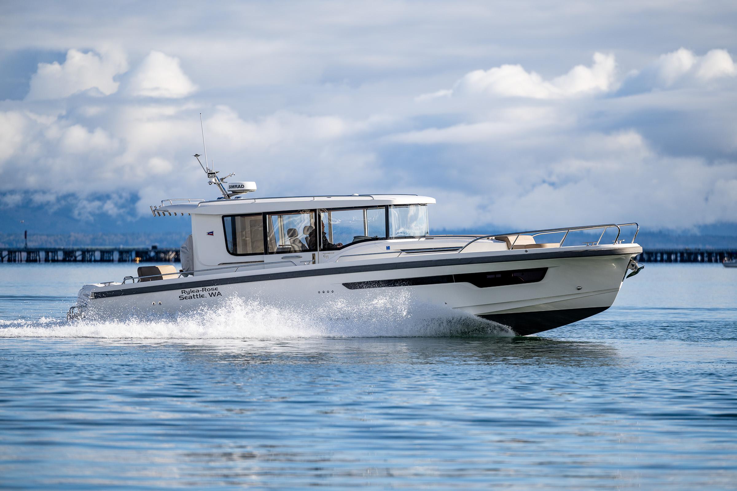 Nimbus-C11 2021-RYLEA ROSE WA-US-2021 Nimbus C11 boat cruising on calm water under cloudy skies.-9586288 | Thumbnail