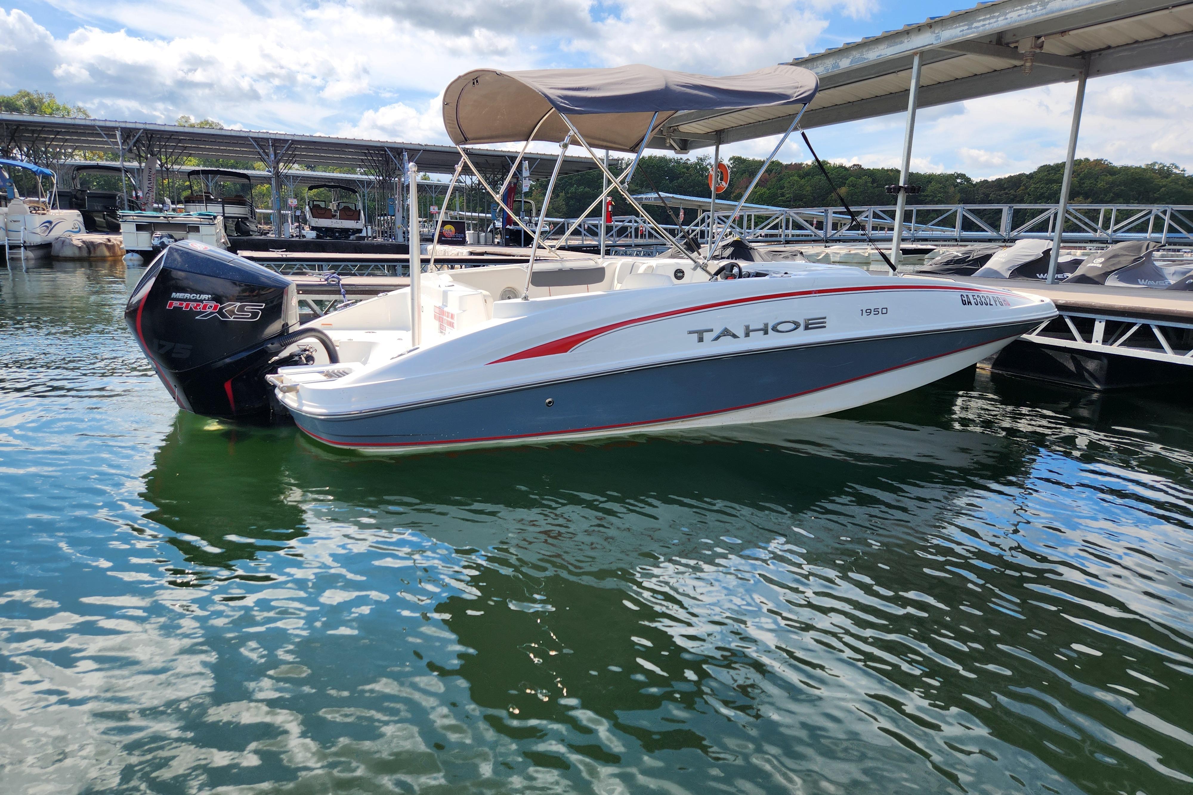 2021 Tahoe 1950 boat docked on a sunny day with Mercury Pro XS engine.