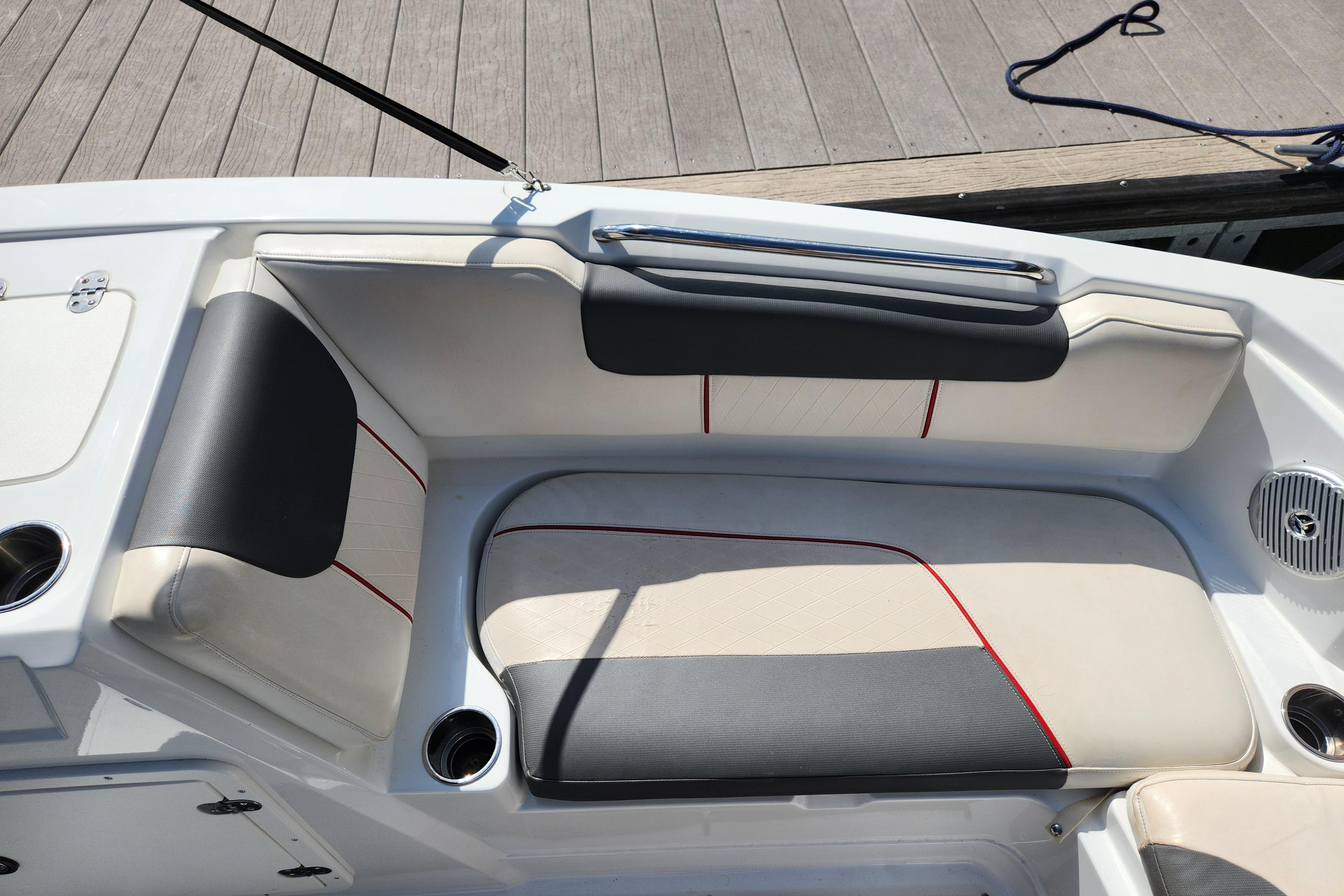 2021 Tahoe 1950 boat interior with cushioned seating and cup holders.