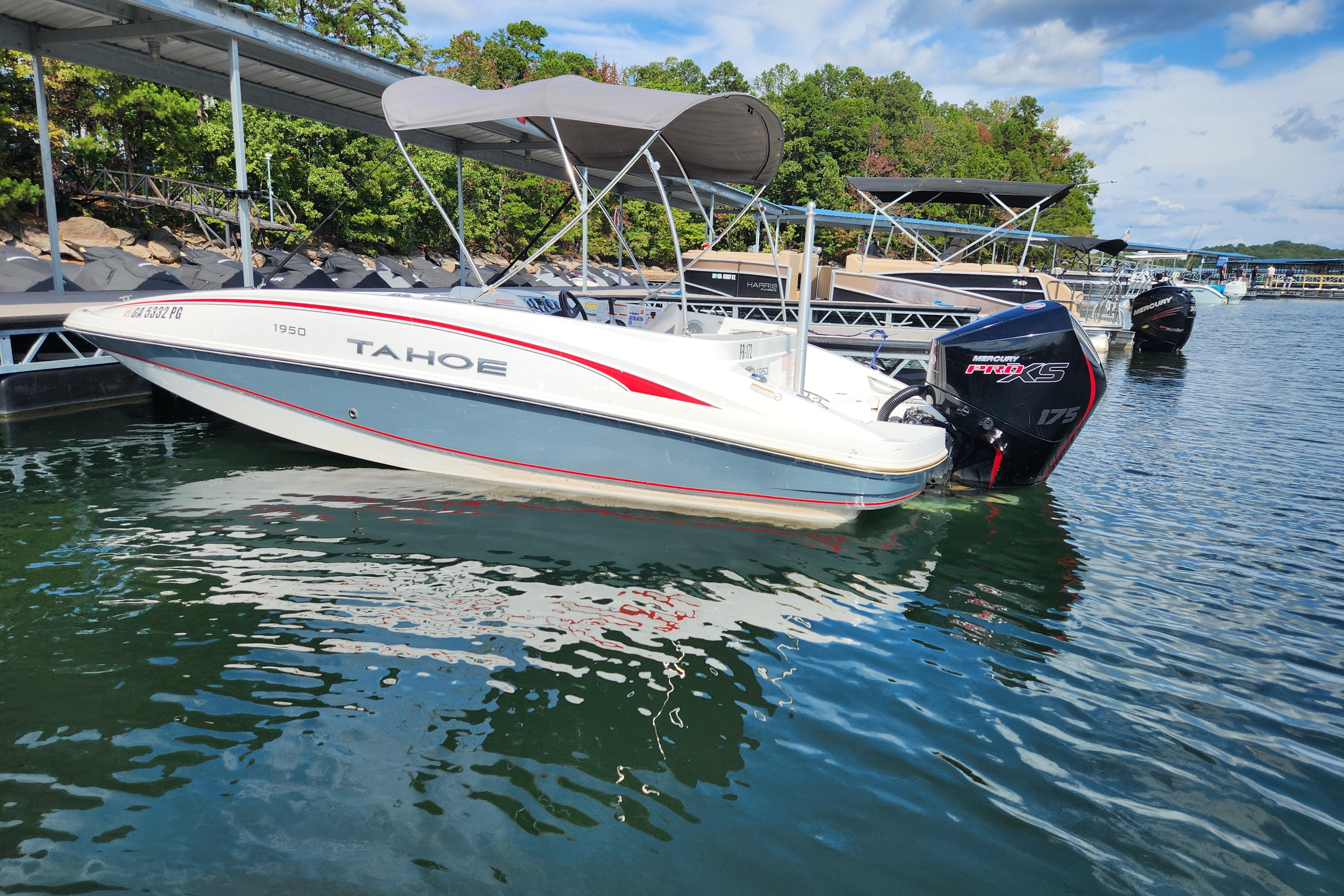 2021 Tahoe 1950 boat docked on a sunny day with Mercury Pro XS engine.