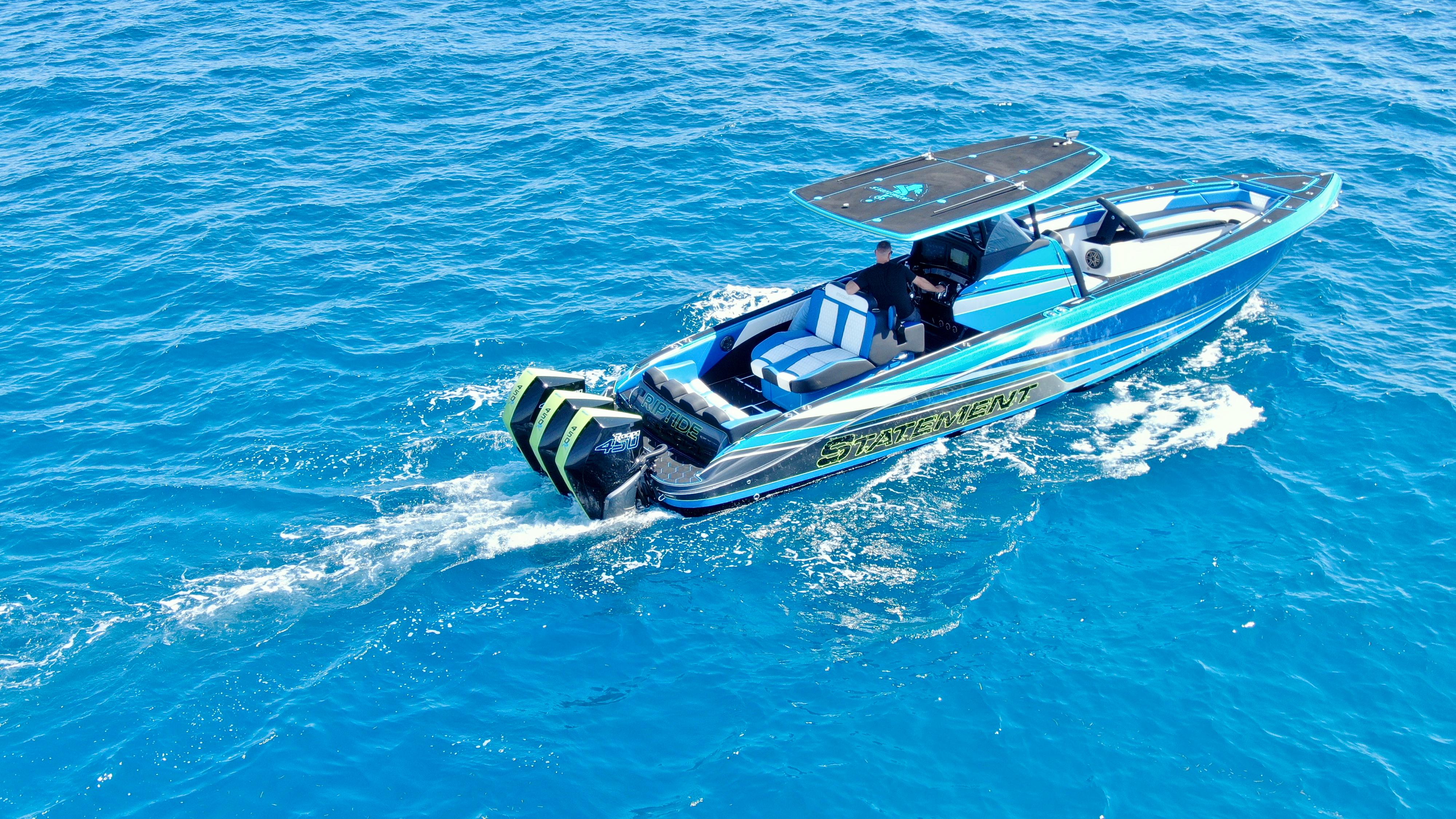 Statement-380 Open 2022-Riptide FL-US-2023 Statement 380 Open boat cruising on clear blue ocean waters.-9716318 | Thumbnail