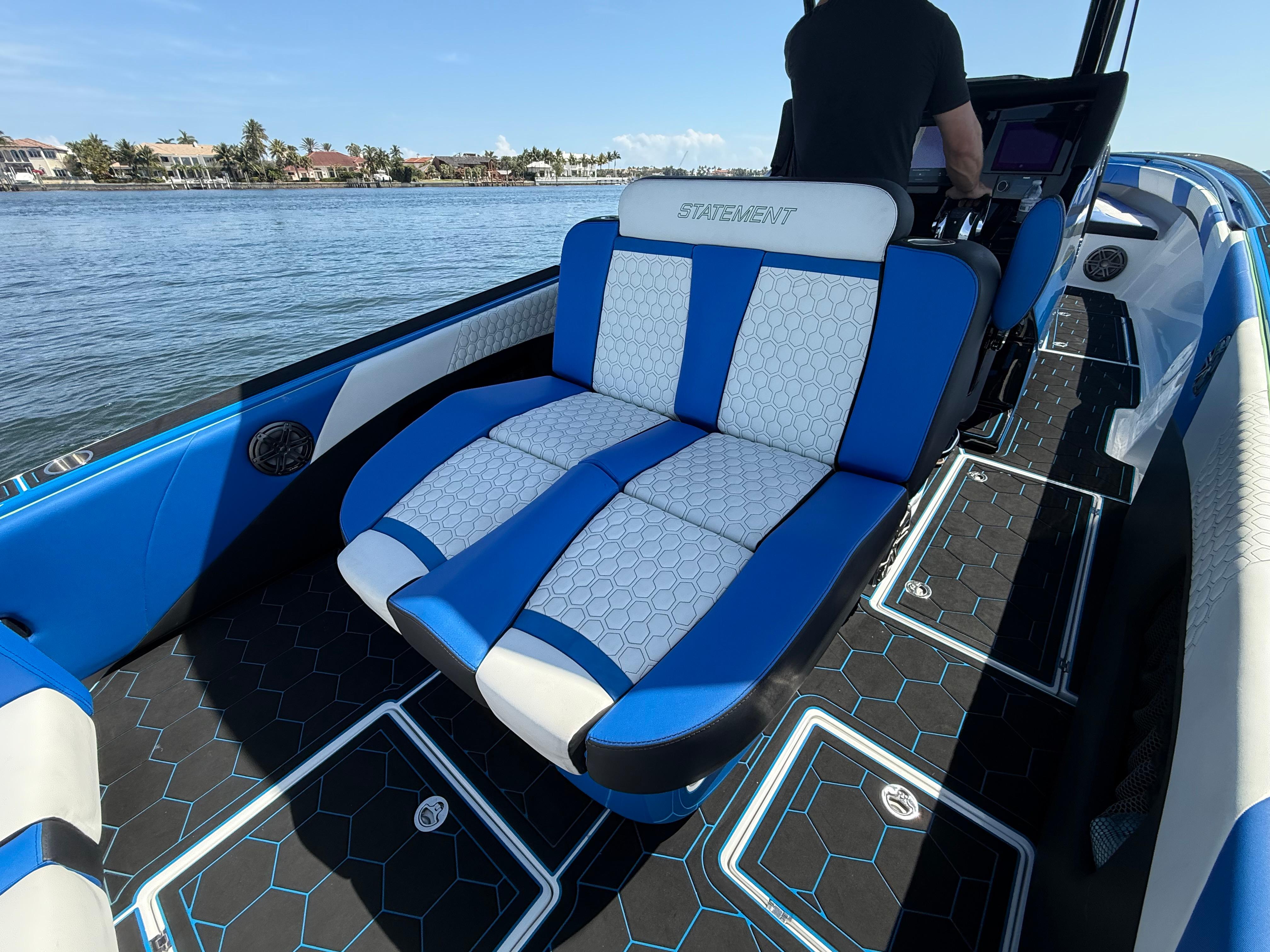 Statement-380 Open 2022-Riptide FL-US-2023 Statement 380 Open boat with blue and white seating on a sunny day.-9716318 | Thumbnail