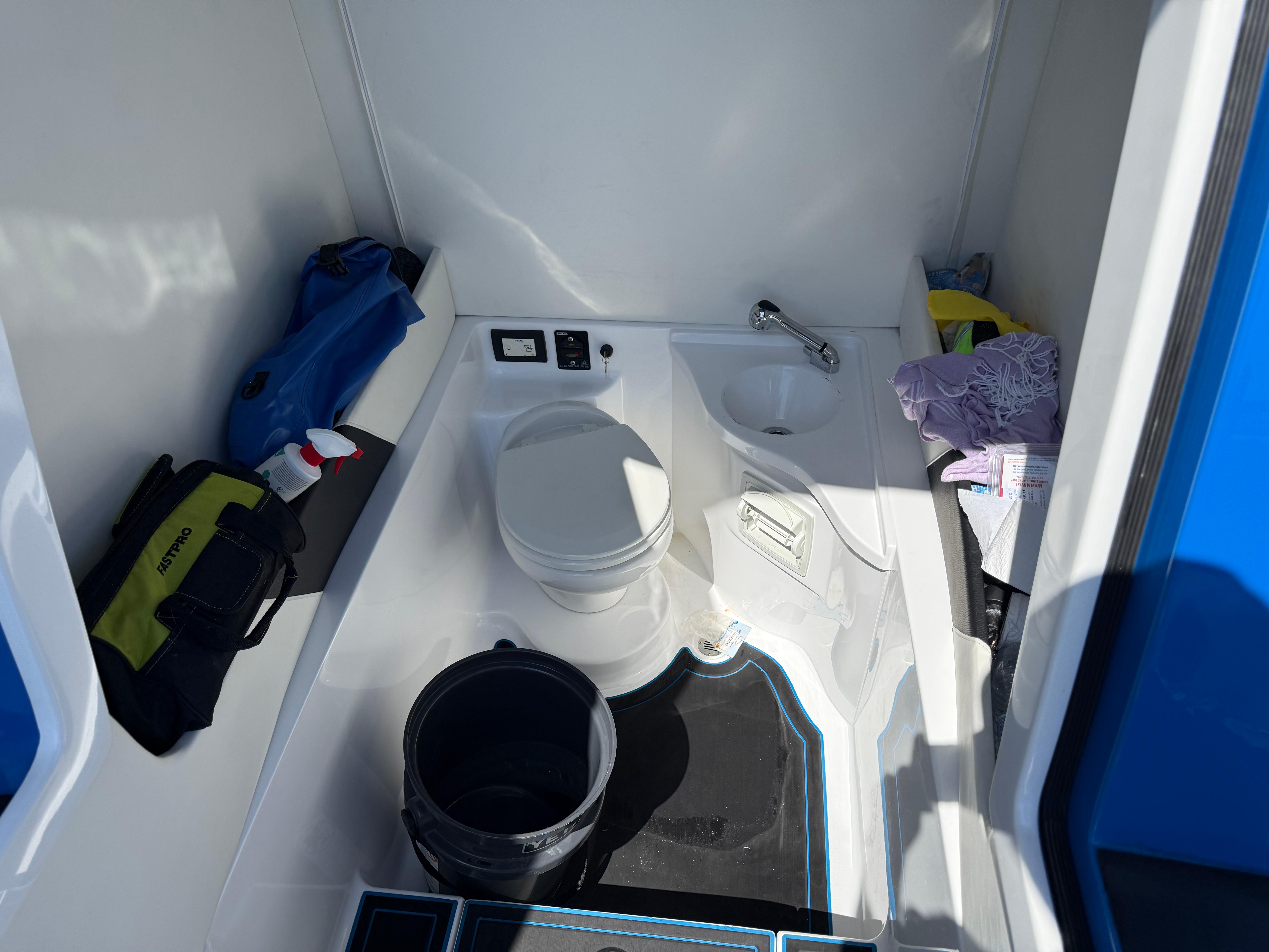Statement-380 Open 2022-Riptide FL-US-Interior of 2023 Statement 380 Open boat bathroom with toilet and sink.-9716318 | Thumbnail