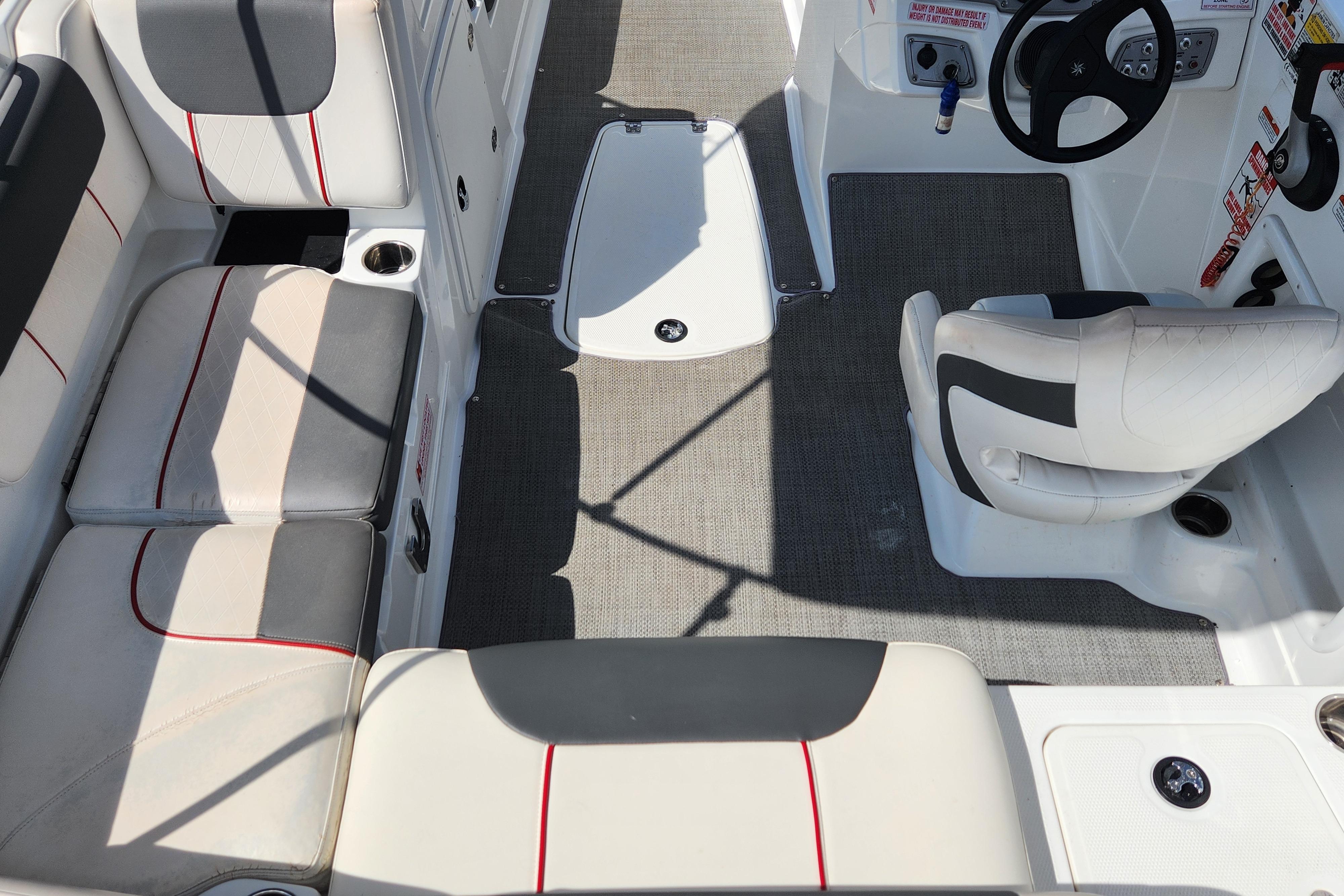 Interior of a 2021 Tahoe 1950 boat with seating and steering area.