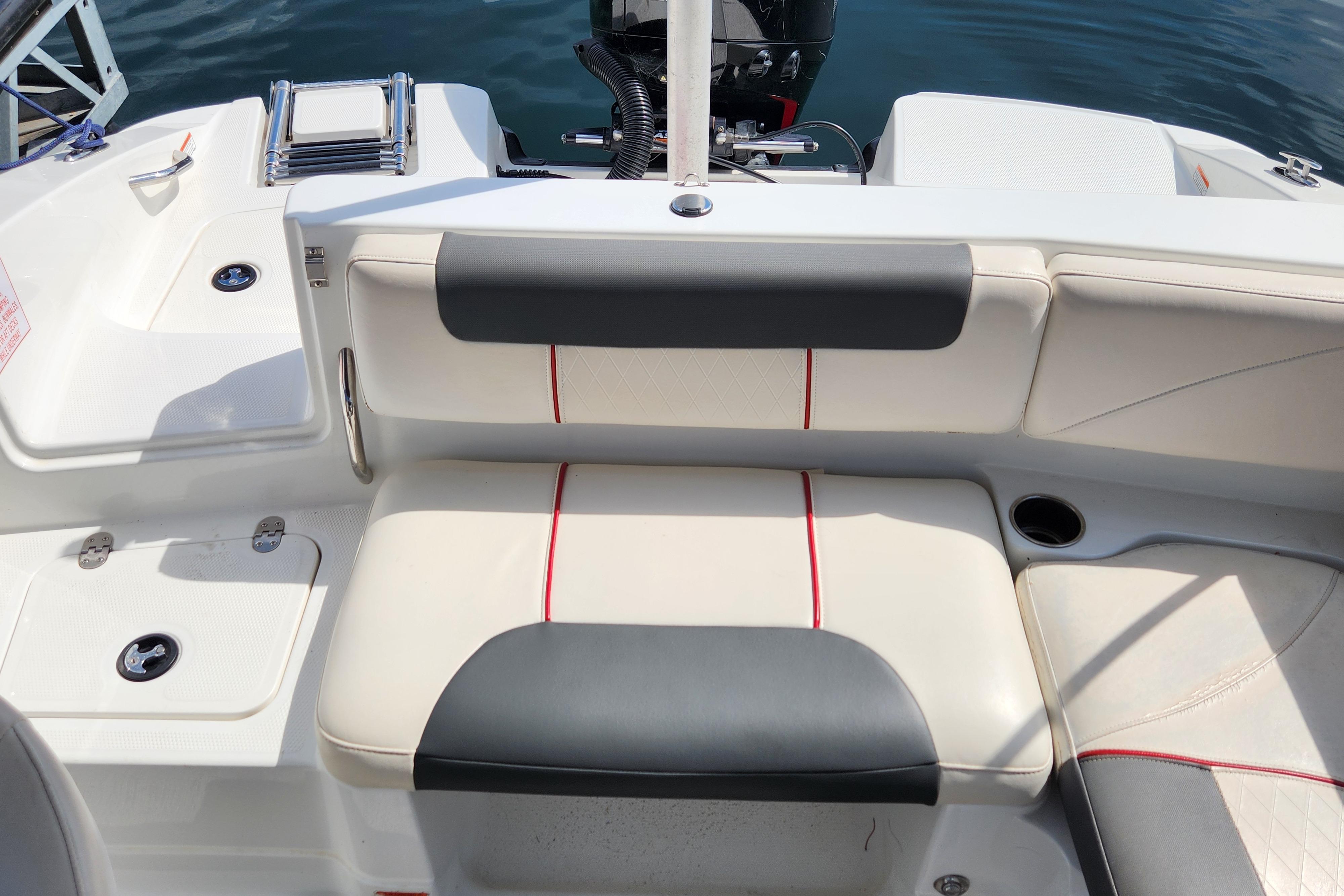 2021 Tahoe 1950 boat interior with cushioned seating and cup holder.