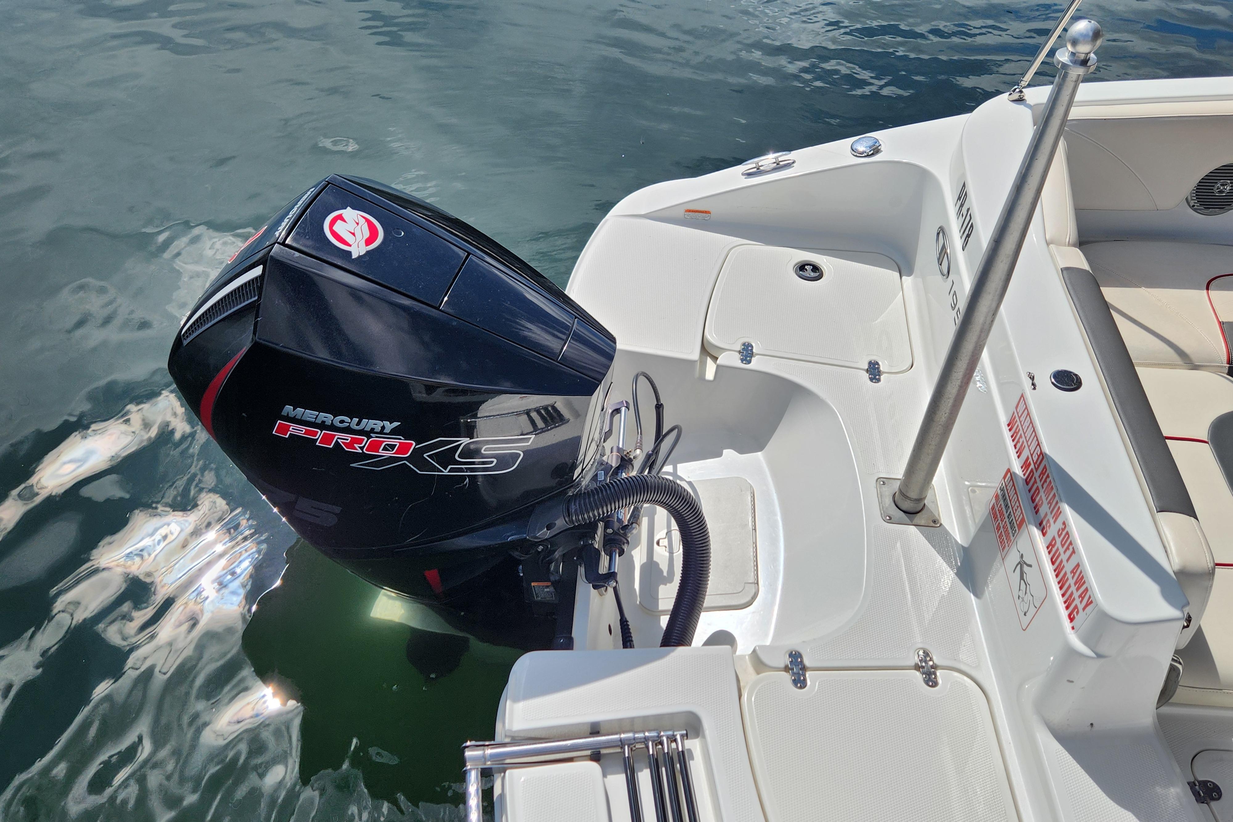 2021 Tahoe 1950 boat with Mercury Pro XS outboard motor on water.