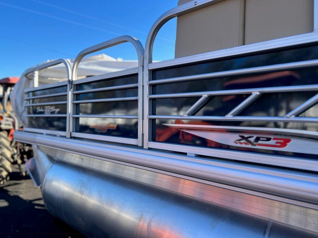 2023 Sun Tracker FISHIN' BARGE® 22 XP3 pontoon boat side view.