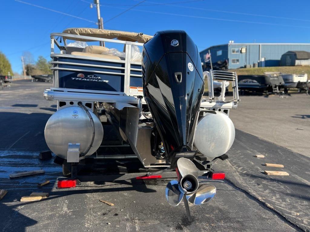 2023 Sun Tracker FISHIN' BARGE® 22 XP3 pontoon boat with outboard motor.