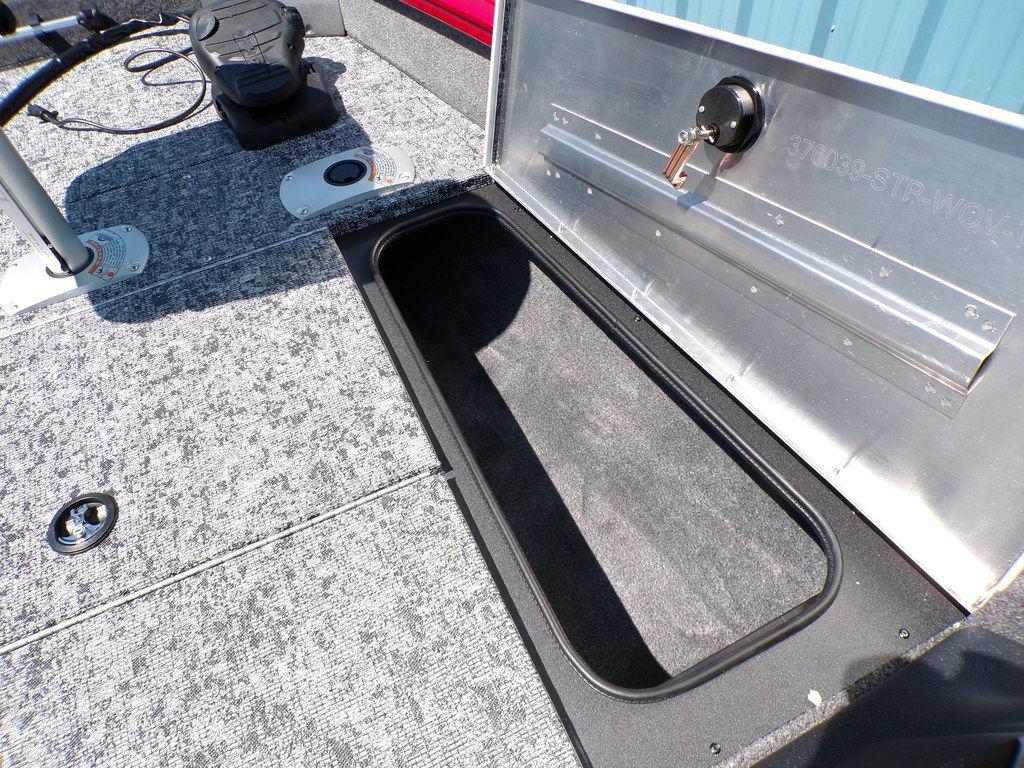 2025 Tracker Pro Team 175 TF® boat storage compartment with textured flooring.