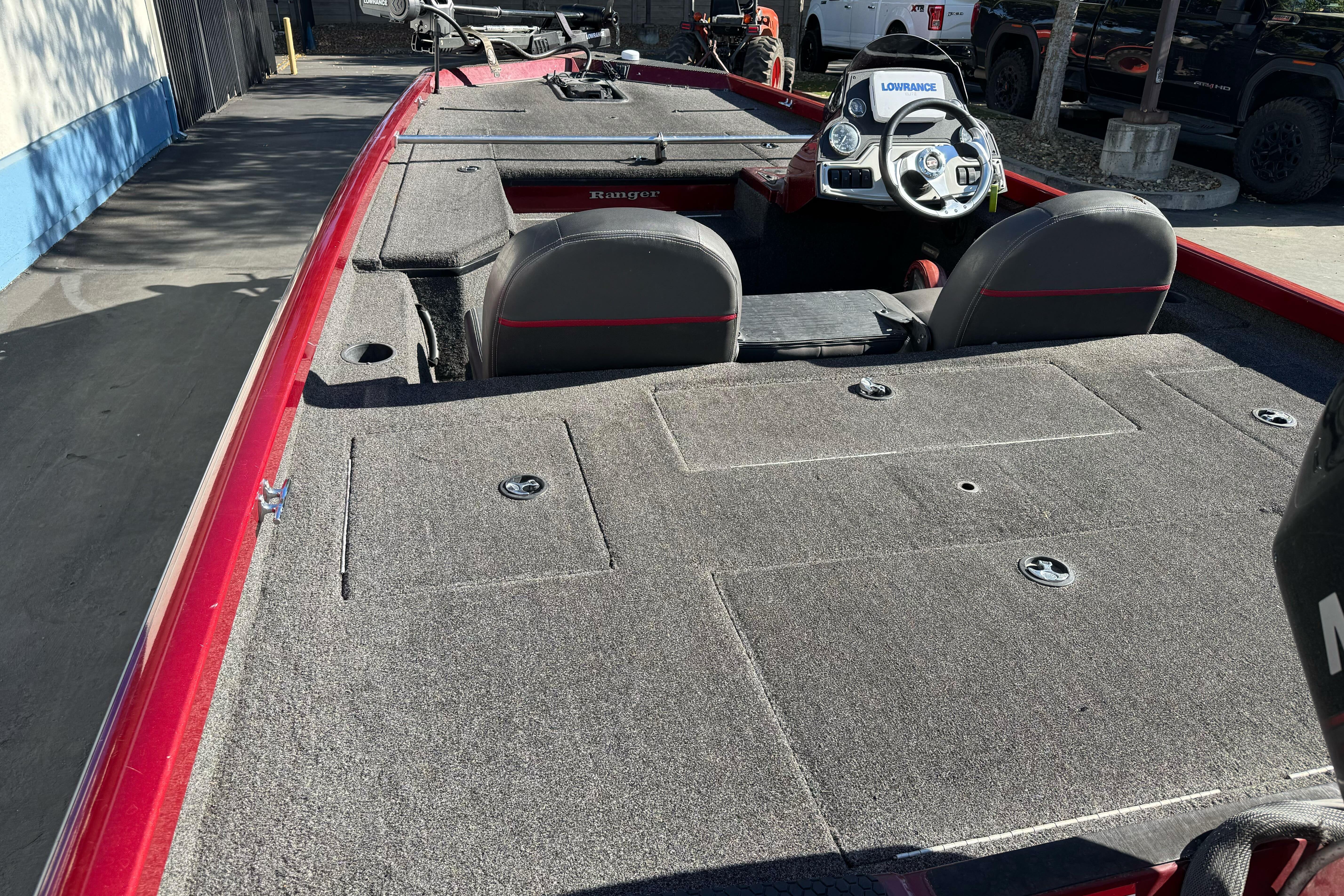 2016 Ranger RT178 fishing boat interior with steering console and carpeted deck.