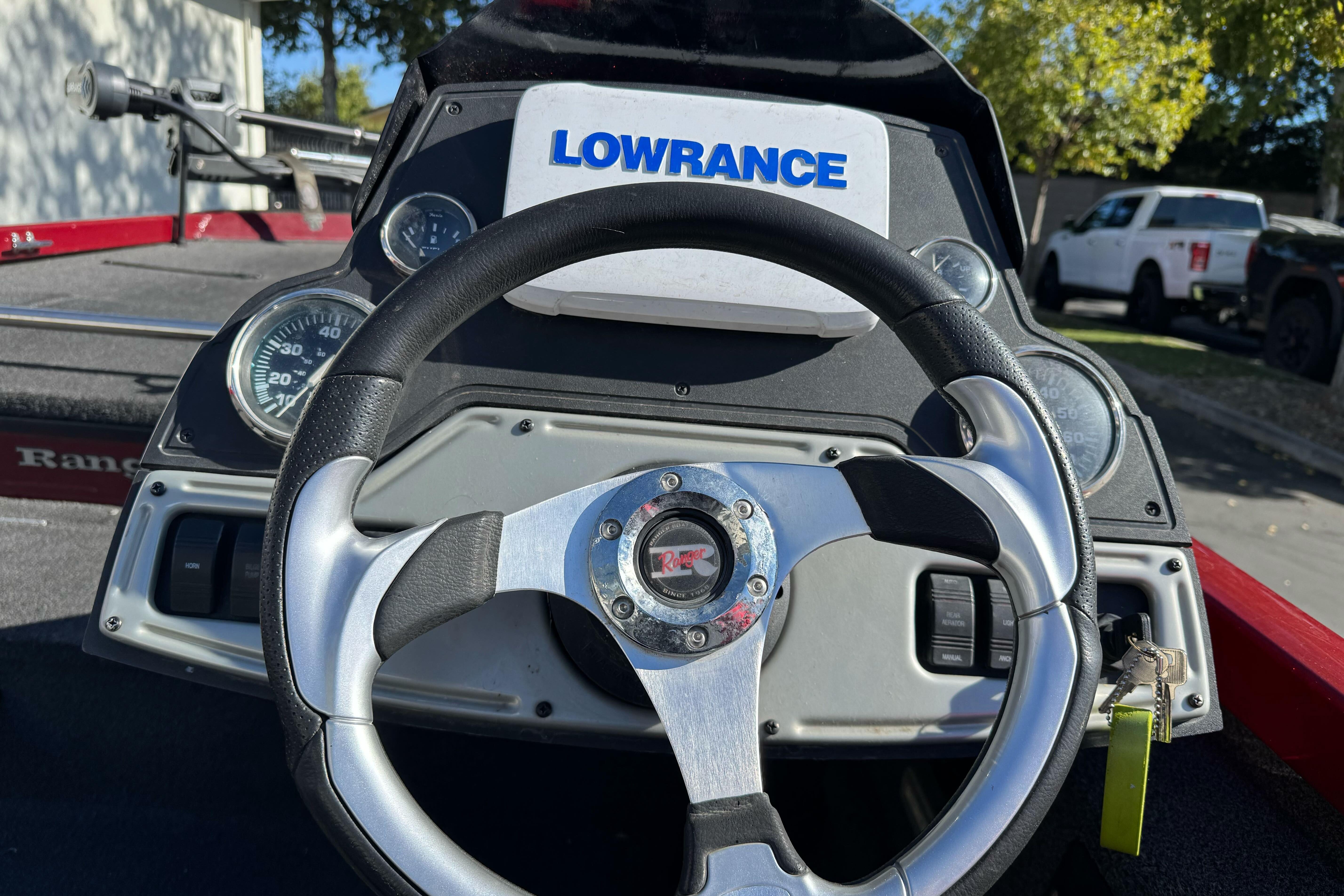 2016 Ranger RT178 boat dashboard with steering wheel and Lowrance display.