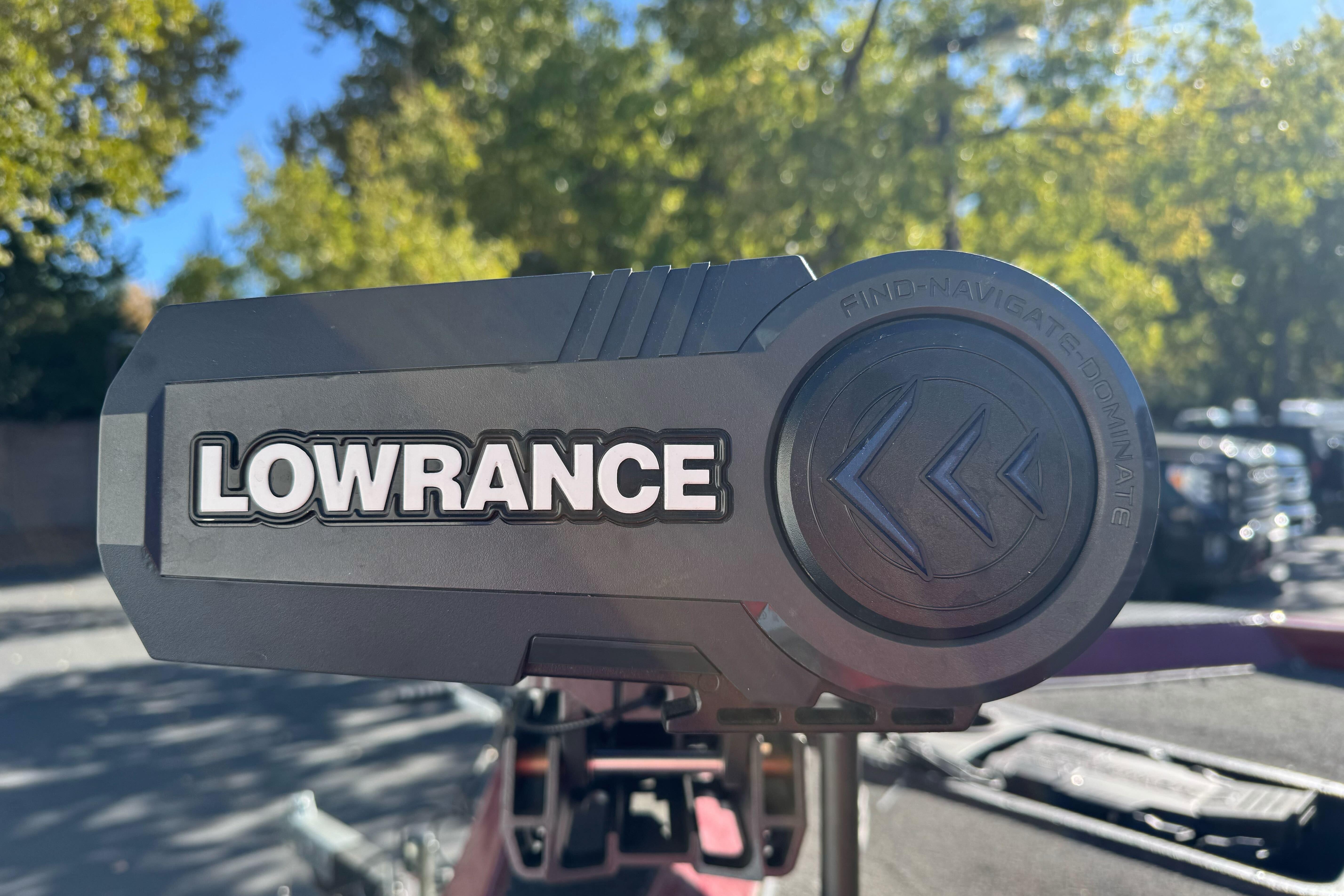 Lowrance device on 2016 Ranger RT178 boat, surrounded by trees and parked vehicles.