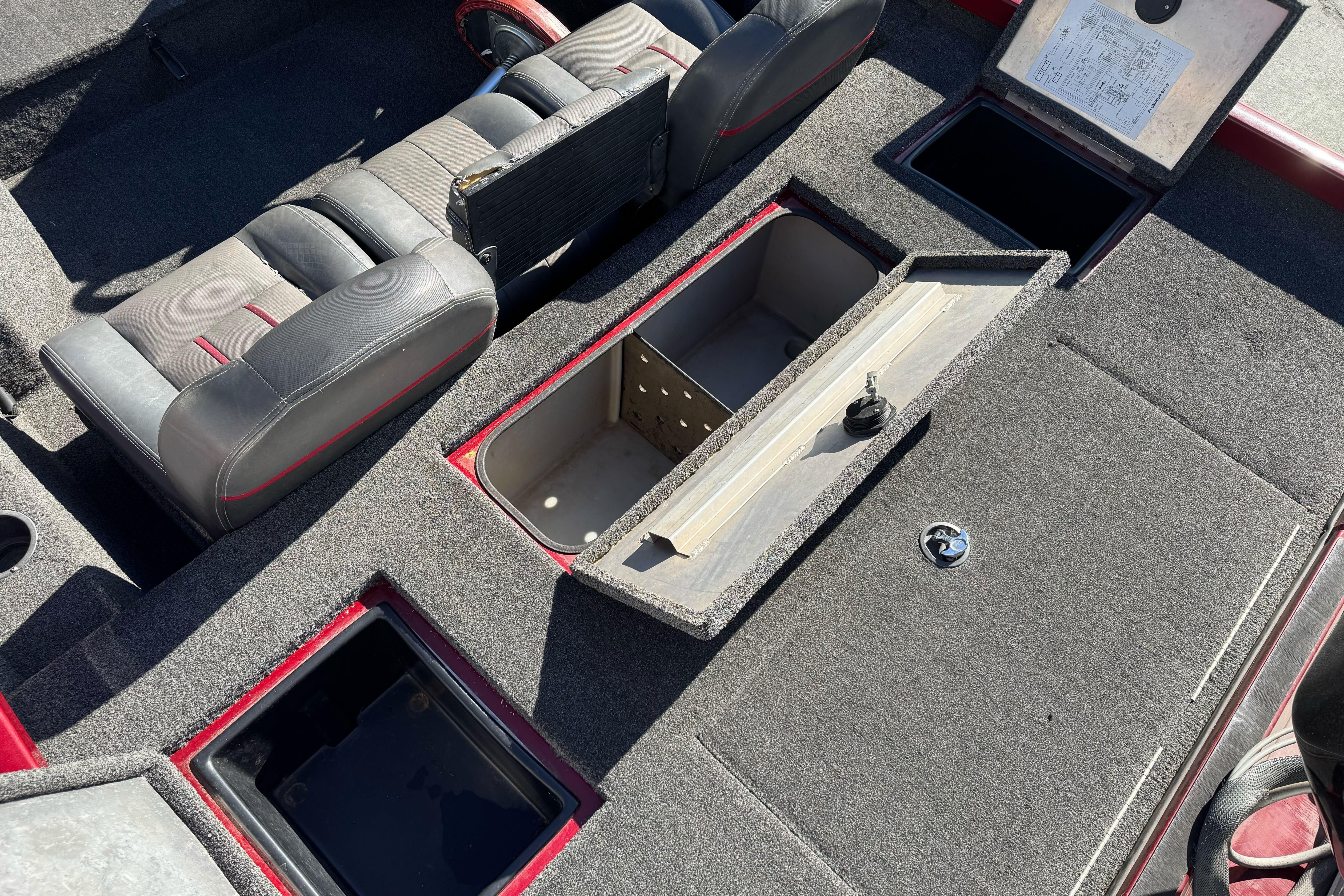 2016 Ranger RT178 boat interior with open storage compartments and seating.