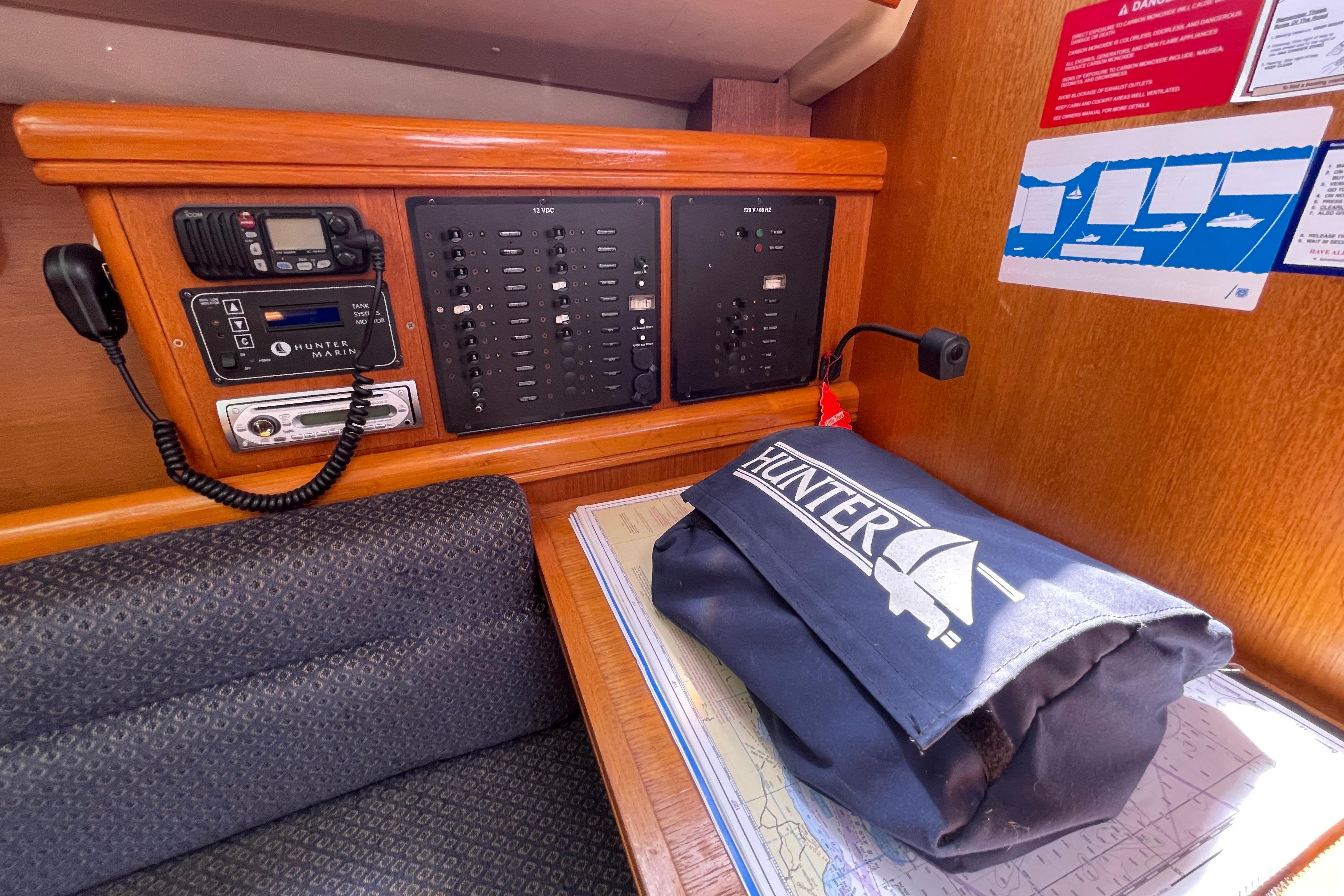 Control panel and equipment inside a 2004 Hunter 33-2 sailboat cabin.