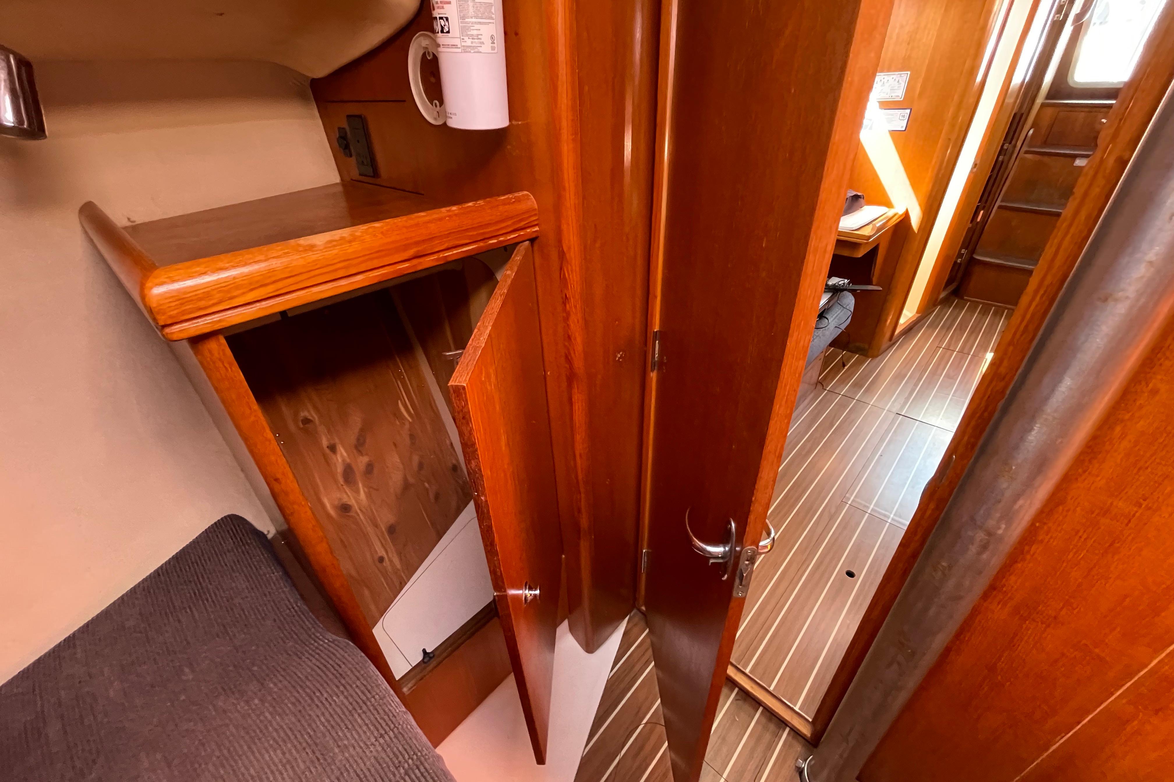 Interior of 2004 Hunter 33-2 sailboat with wooden cabinetry and flooring.