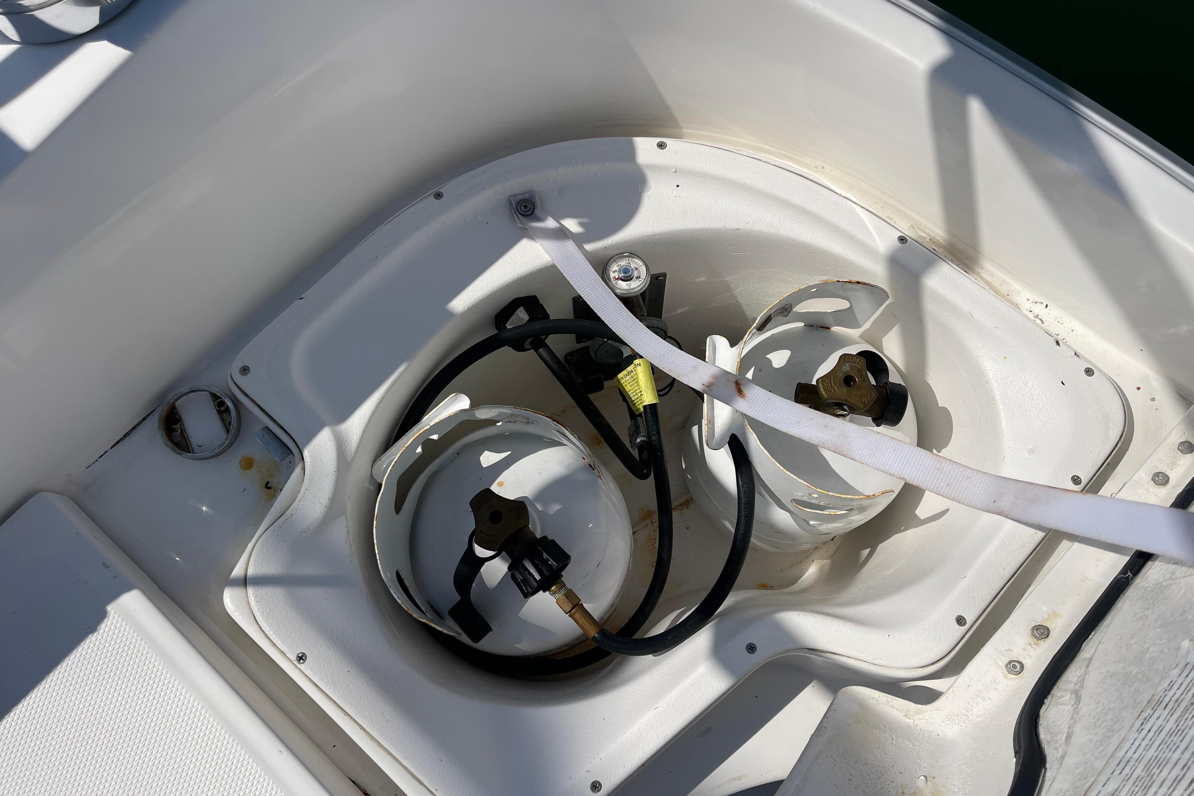 Propane tank storage on 2004 Hunter 33-2 sailboat deck.