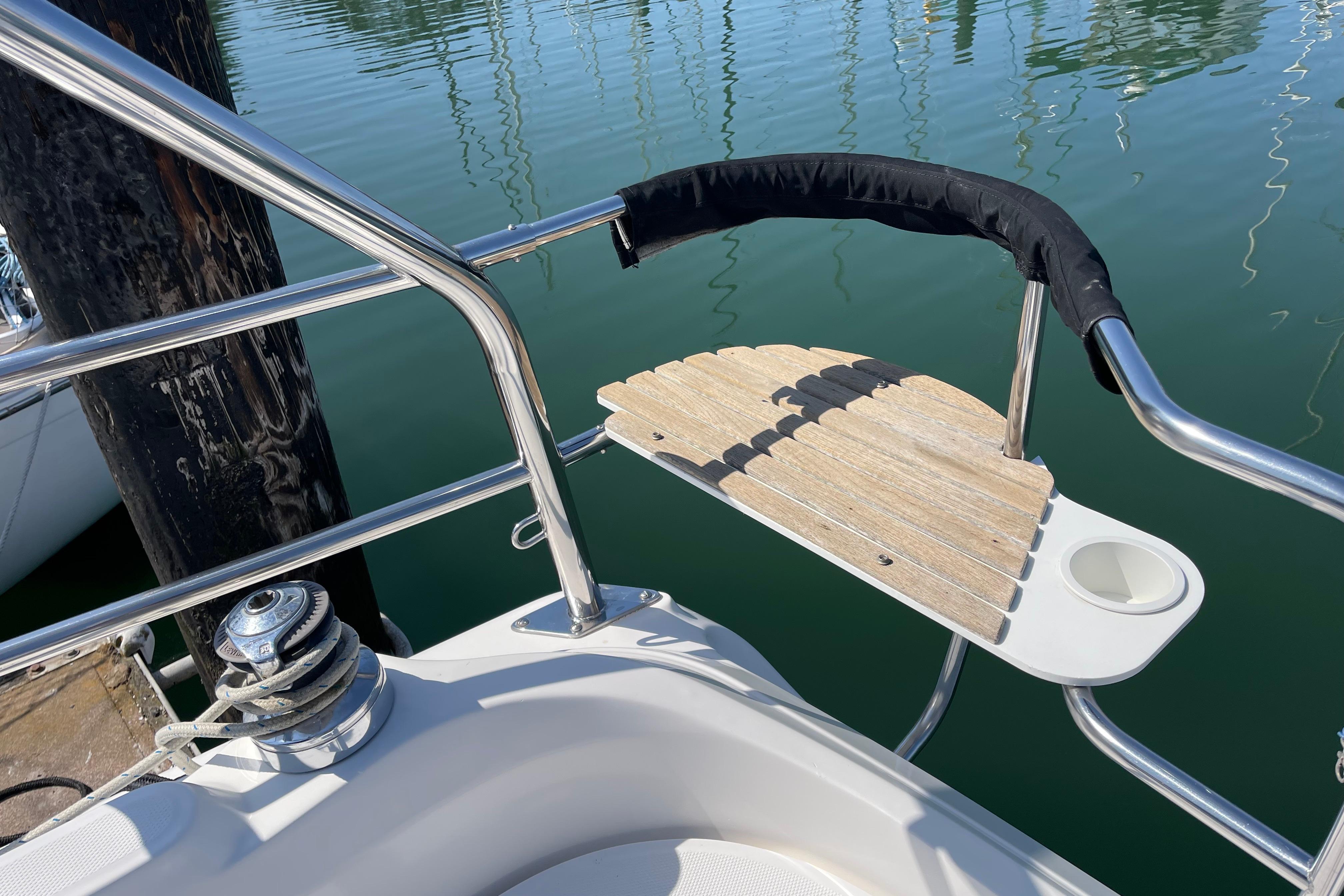 Stainless steel and wood swim platform on 2004 Hunter 33-2 sailboat.