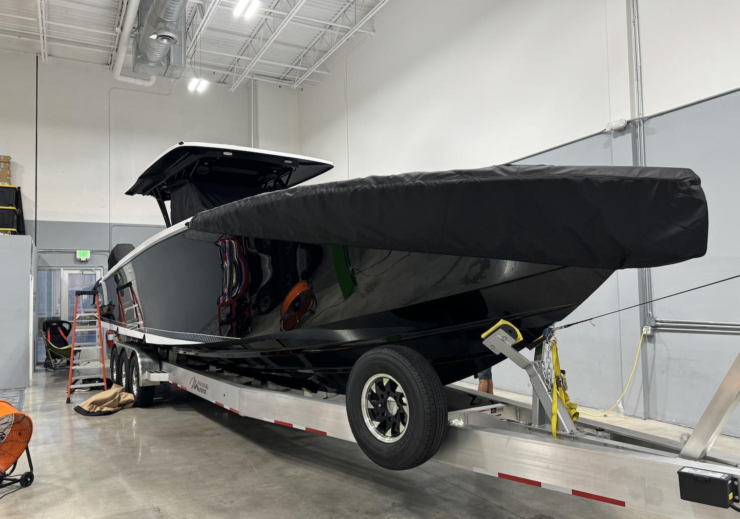 Nor-Tech-390 Sport Center Console 2023 -KY-US-2023 Nor-Tech 390 Sport Center Console boat on trailer in indoor storage.-9746423 | Thumbnail