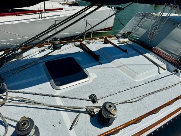 Deck of 1979 Islander IP Peterson 40 sailboat with winches and rigging.