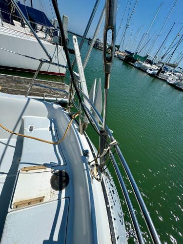1979 Islander IP Peterson 40 sailboat docked in a marina, showing deck and rigging.