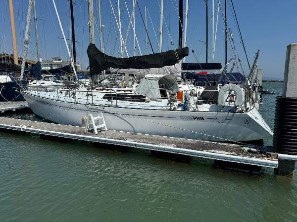 1979 Islander IP Peterson 40 sailboat docked at marina, surrounded by other vessels.