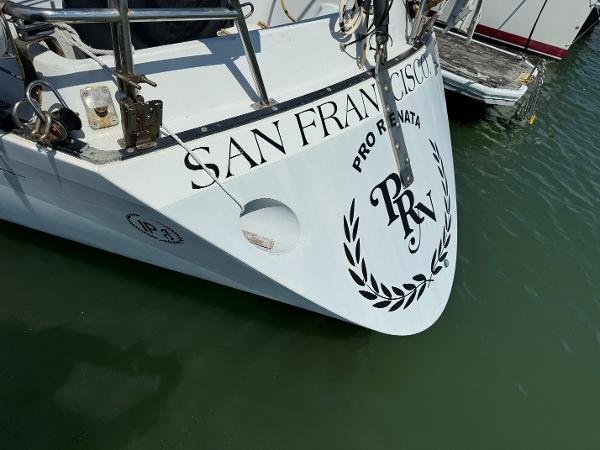 Bow of 1979 Islander IP Peterson 40 sailboat docked in San Francisco marina.