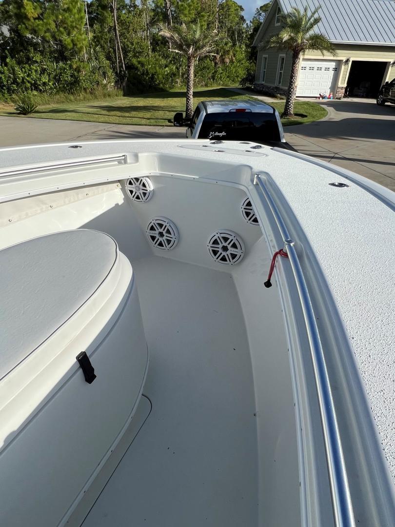 Yellowfin-32 Offshore 2016-32 Yellowfin FL-US-2016 Yellowfin 32 Offshore boat interior with speakers, parked in a residential driveway.-9806474 | Thumbnail